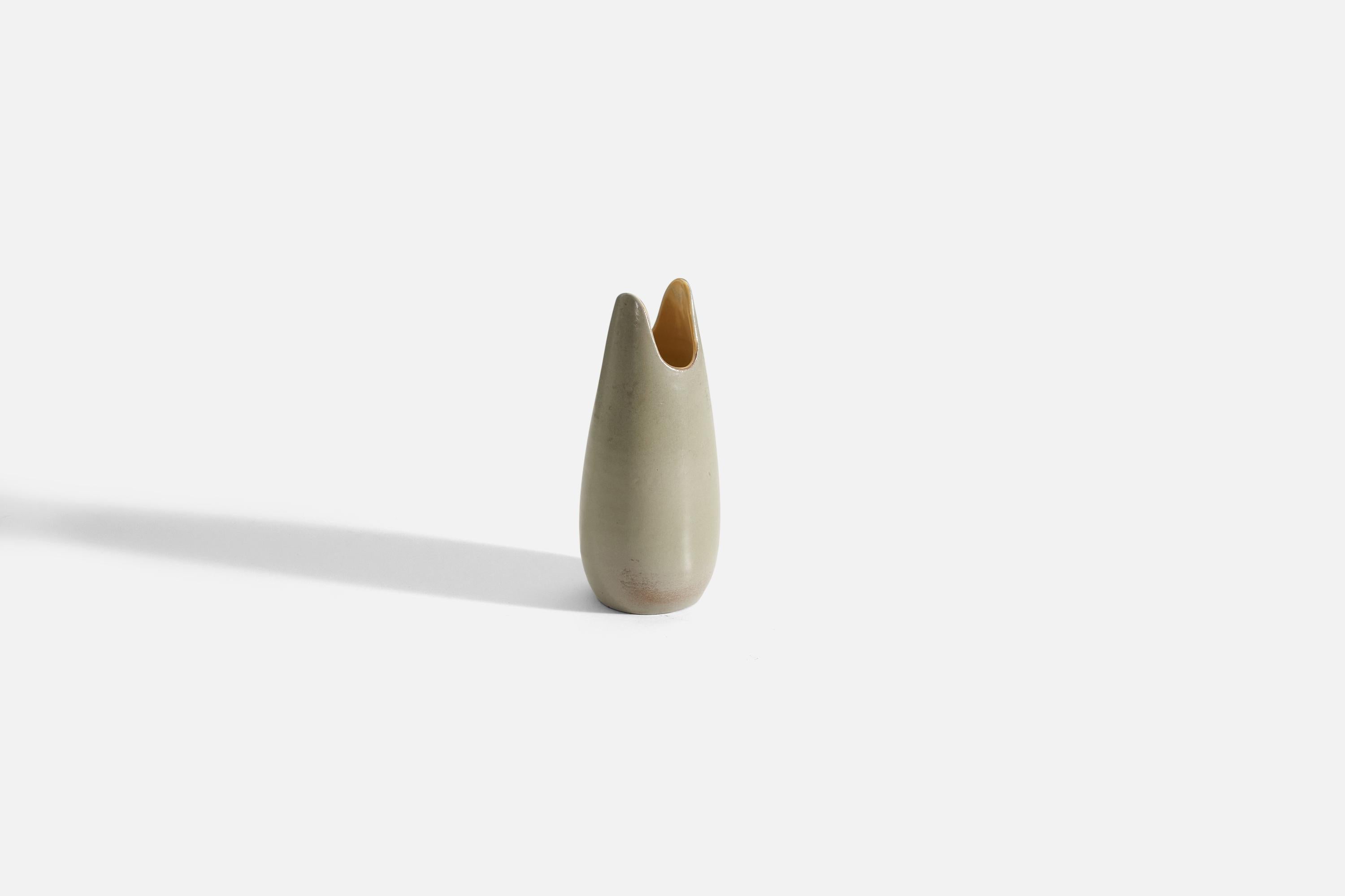 A cream, and yellow glazed earthenware vase designed by Mari Simmulson for Upsala Ekeby, Sweden, 1950s. 

 