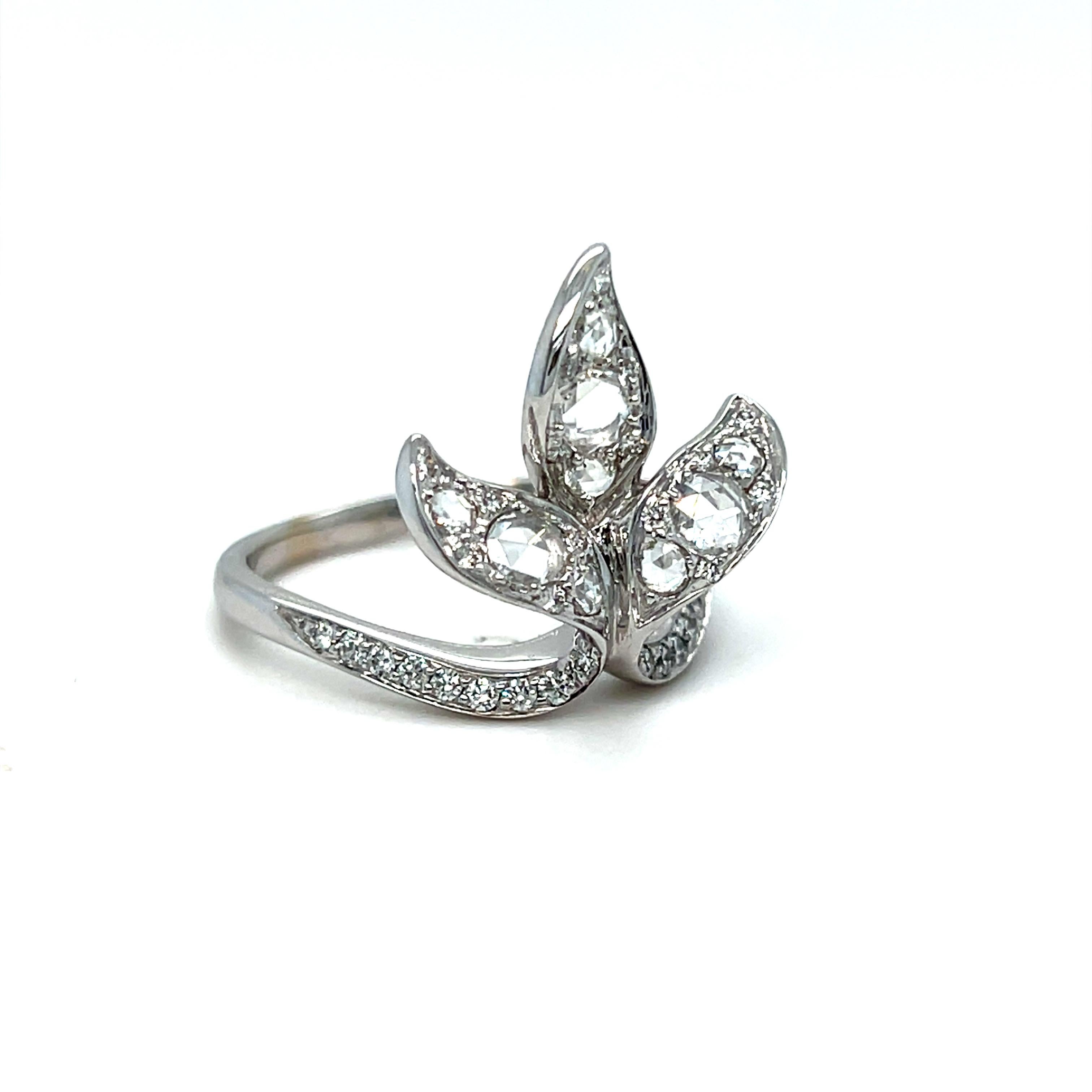 LOVE LOVE LOVE!! This gorgeous Leaf Cluster Diamond Ring is a elegant and unique design that is just as well made as it is beautiful. Crafted in 18K White Gold, the design features a large super sparkly petal, entirely Pave Set with Rose Cut