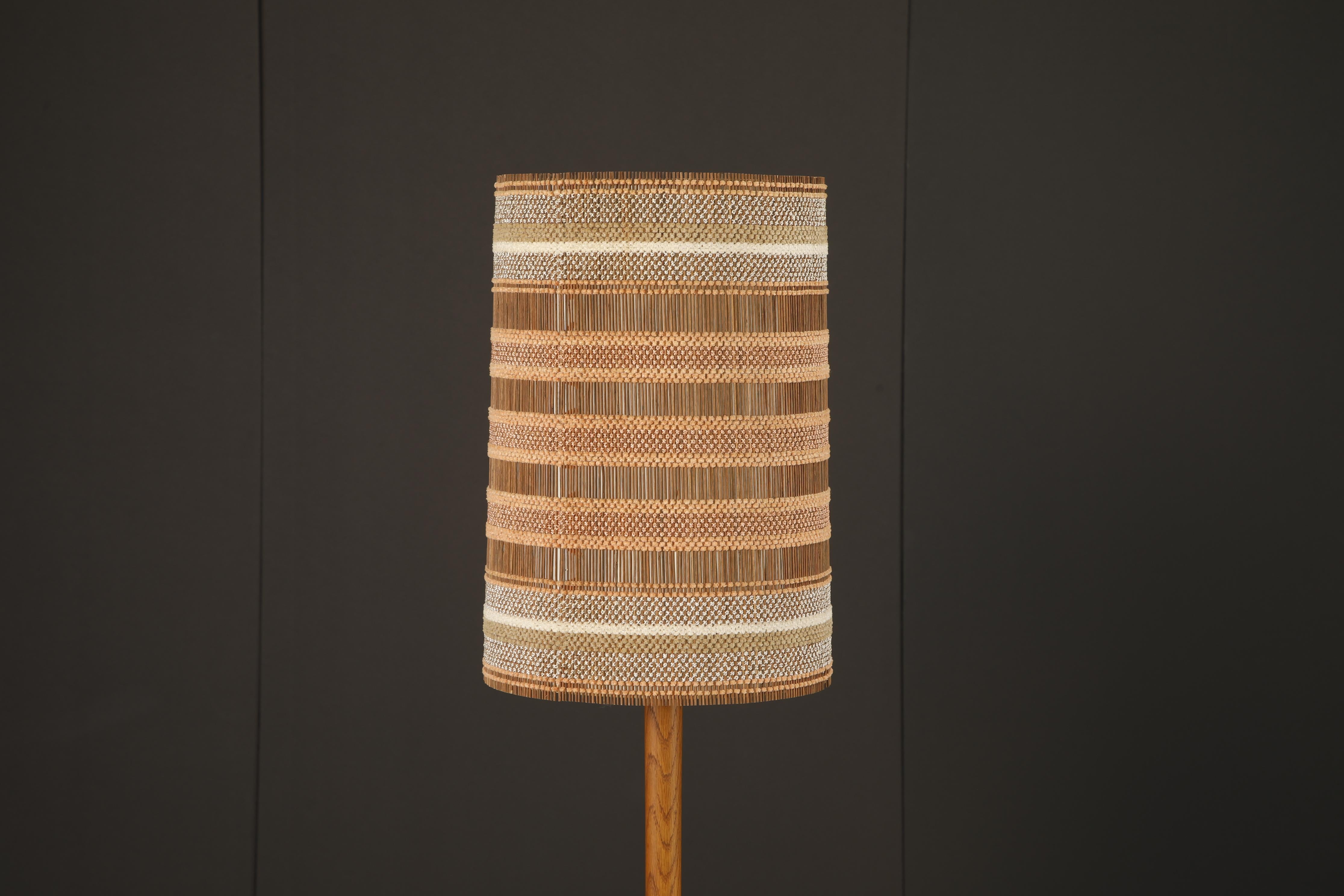 A rare and striking lampshade designed by German-born, California-based textile artist Maria Kipp, celebrated for her masterful use of handwoven fibers in postwar interiors. This piece exemplifies her signature blend of organic texture and modernist
