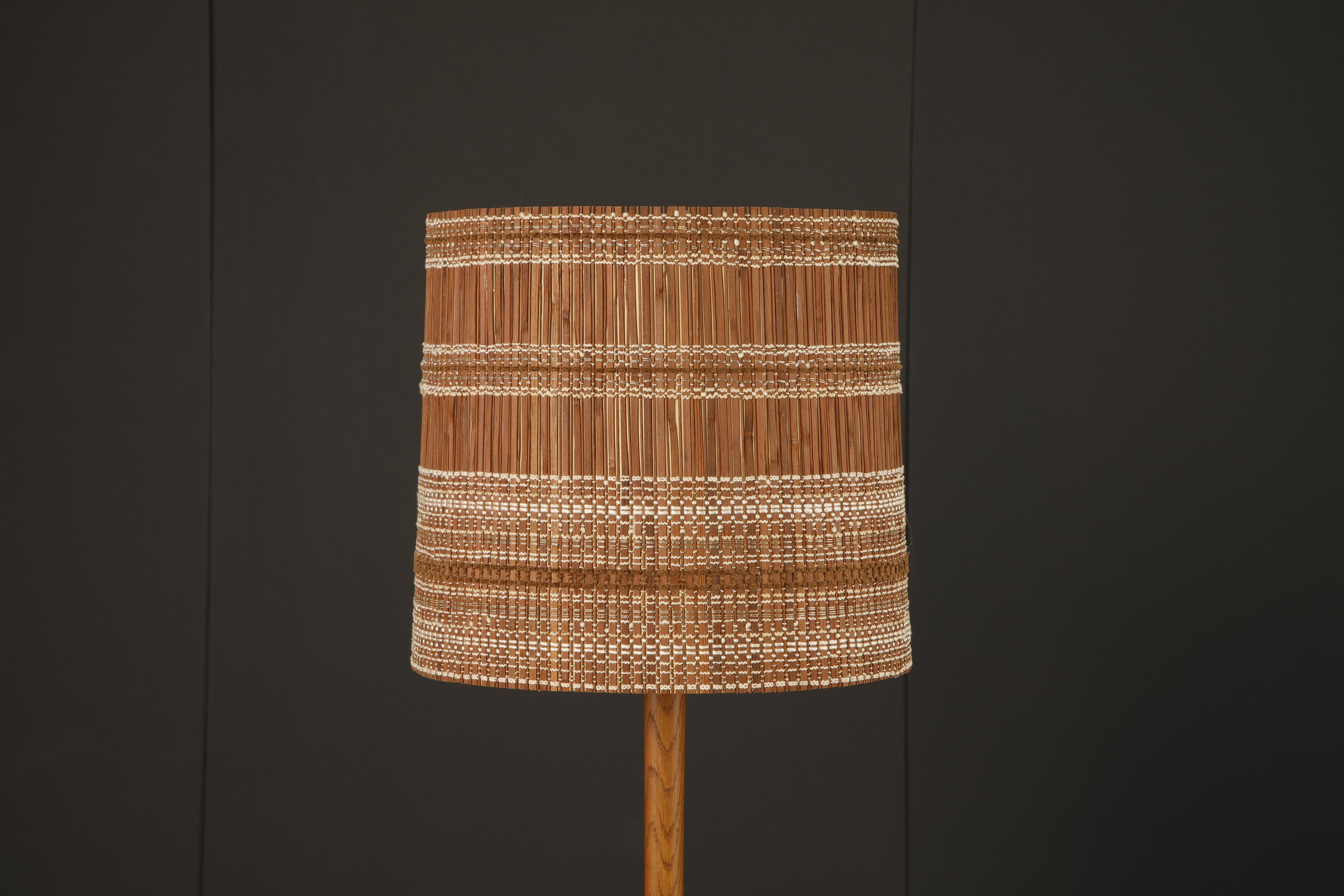 A rare and striking lampshade designed by German-born, California-based textile artist Maria Kipp, celebrated for her masterful use of handwoven fibers in postwar interiors. This piece exemplifies her signature blend of organic texture and modernist