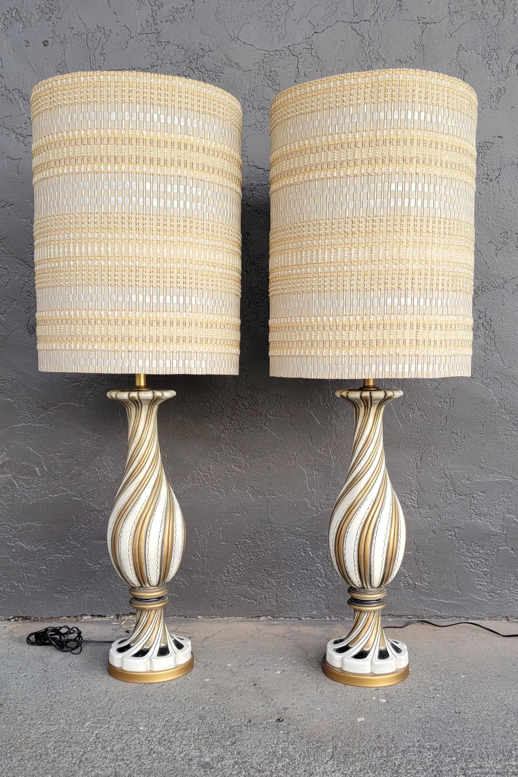 Spectacular pair of Maria Kipp table lamps with original bases. Shade colors complement and fit the bases beautifully. When lit a light blue glow appears within the color palette. At first look bases appear to be murano glass, but in fact are cast
