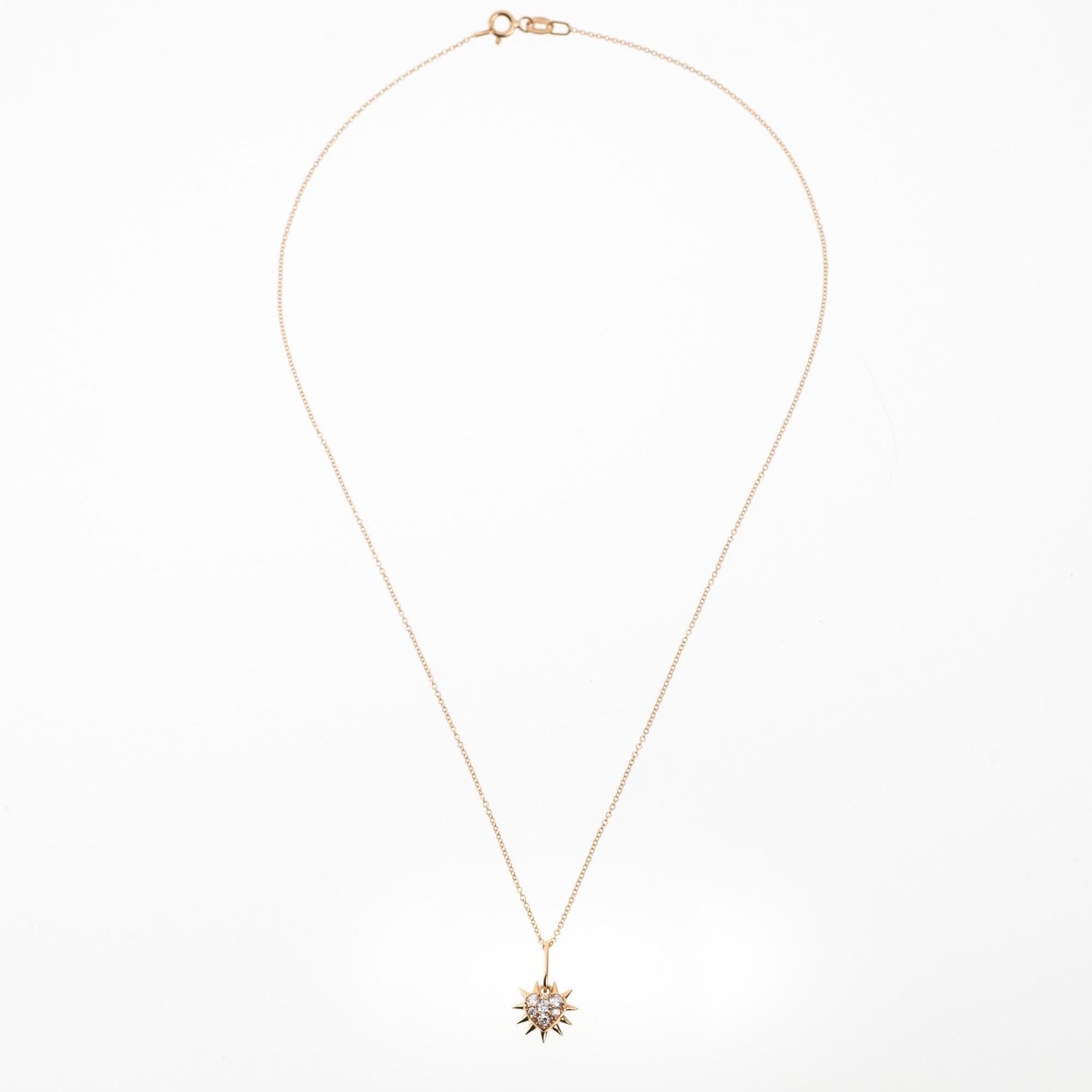 The ‘Thorny heart’ pendant necklace is crafted in 18K gold hallmarked in Cyprus. This cute heart pendant necklace, comes in a highly polished finish and is set with 0.21 Cts of White Diamonds. The charm can be purchased alone or with a standard 40