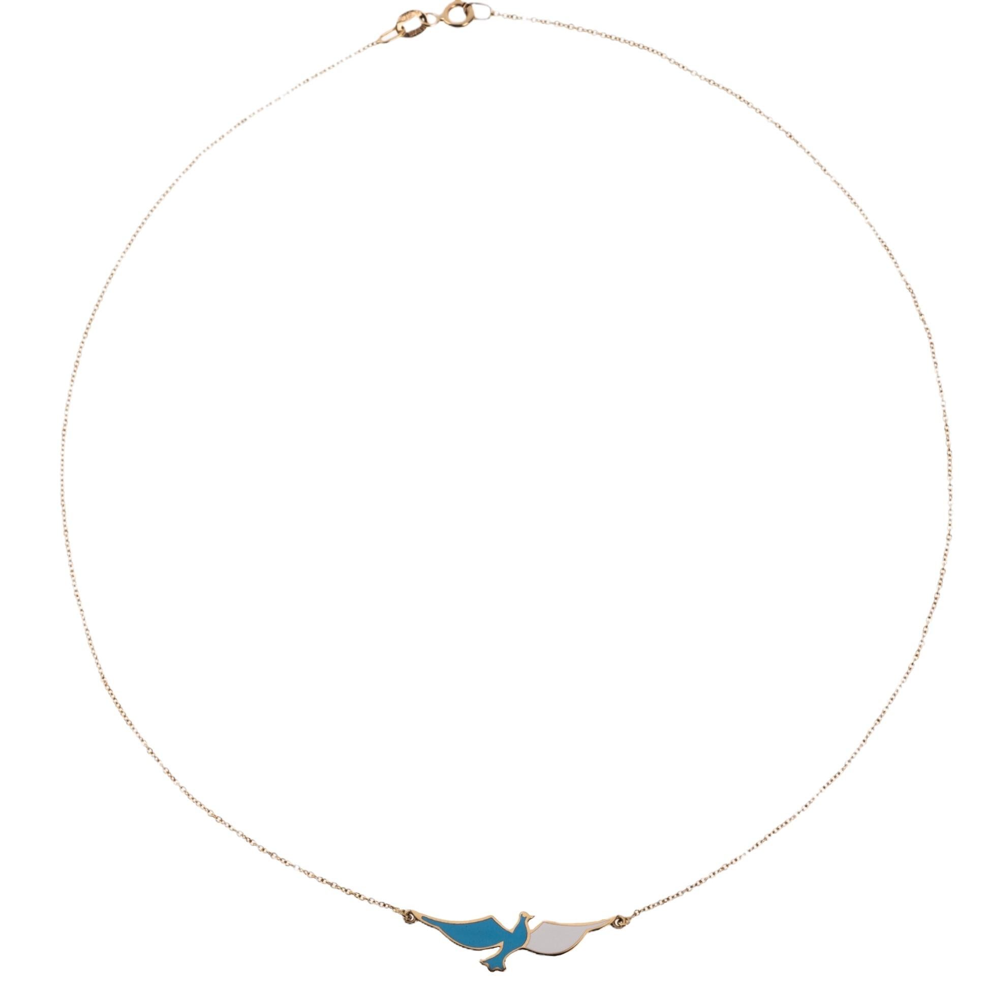 The Flying Dove, necklace is crafted in 18K yellow gold, hallmarked in Cyprus. This exquisite piece of jewelry comes in a highly polished finish with white enamel.  It is also available in different color combinations, allowing you to select the one