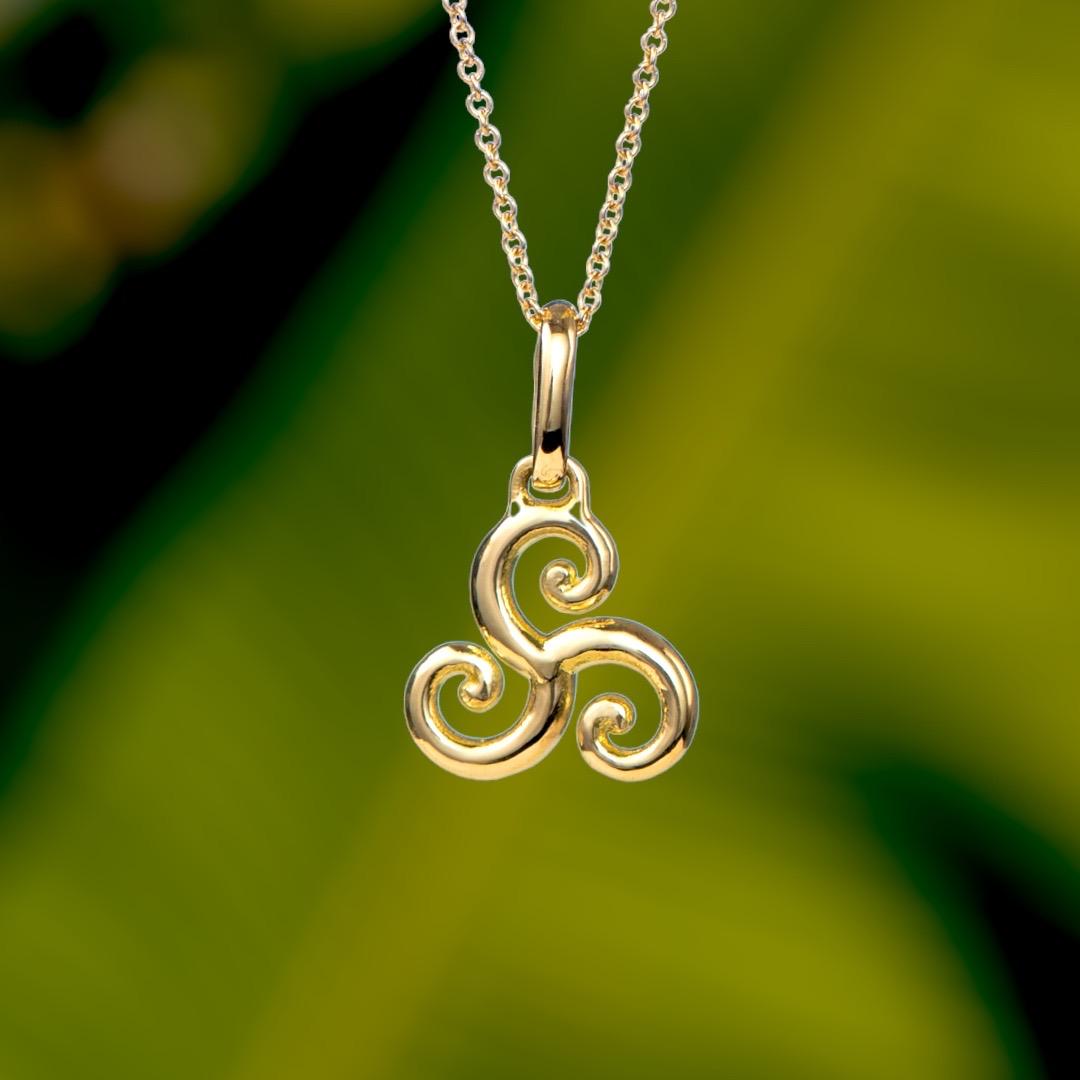 The Triskelion, charm for 2023, is crafted in 18K gold hallmarked in Cyprus. The triple spiral or Triskelion, derived from Greek for three legged, is one of the oldest symbols used by many cultures across the globe between the Neolithic to Bronze