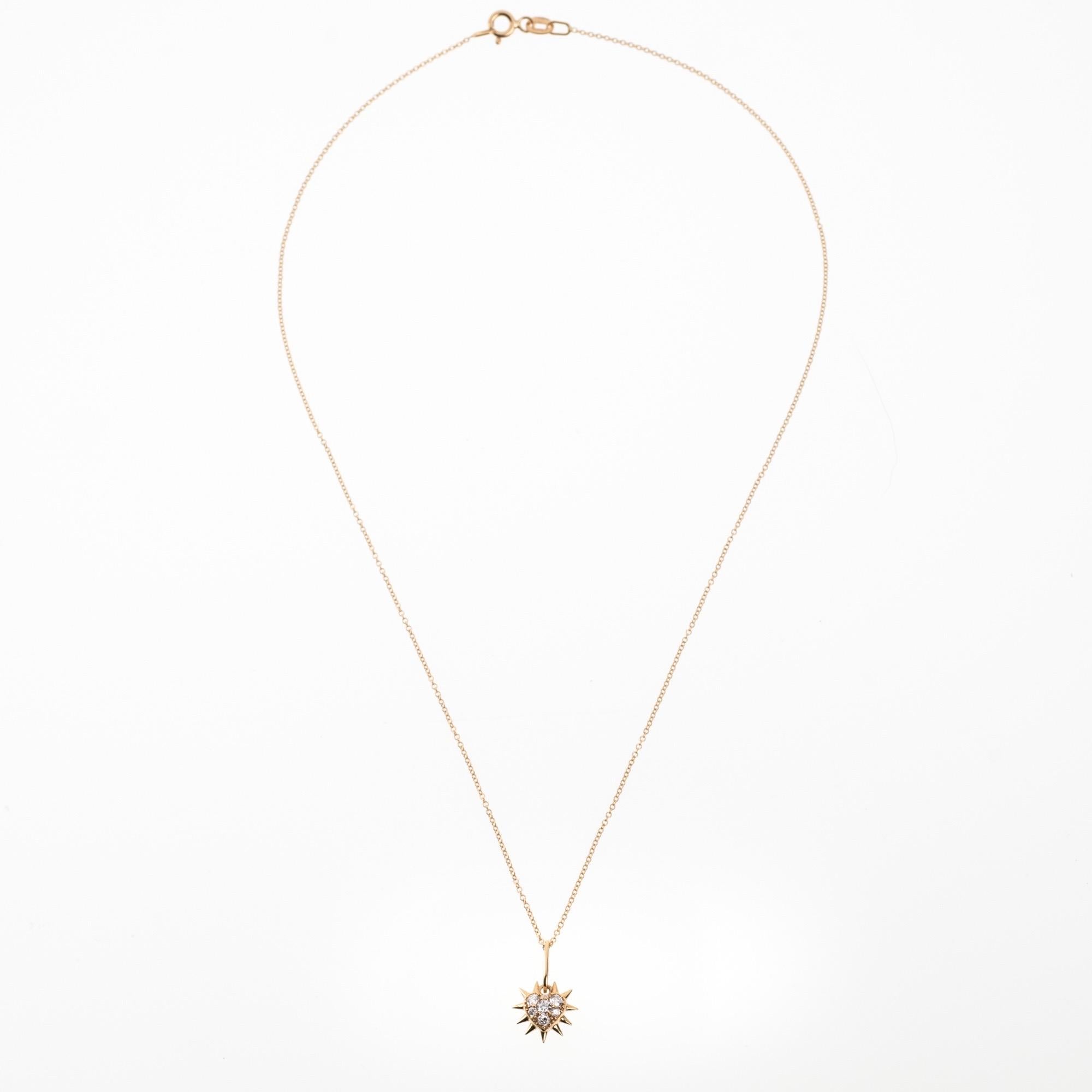 The ‘Thorny heart’ pendant necklace is crafted in 18K gold hallmarked in Cyprus. This charming heart-shaped pendant comes in a highly polished finish and is set with 0.21 Cts of White Diamonds. The pendant can be purchased alone or with a standard