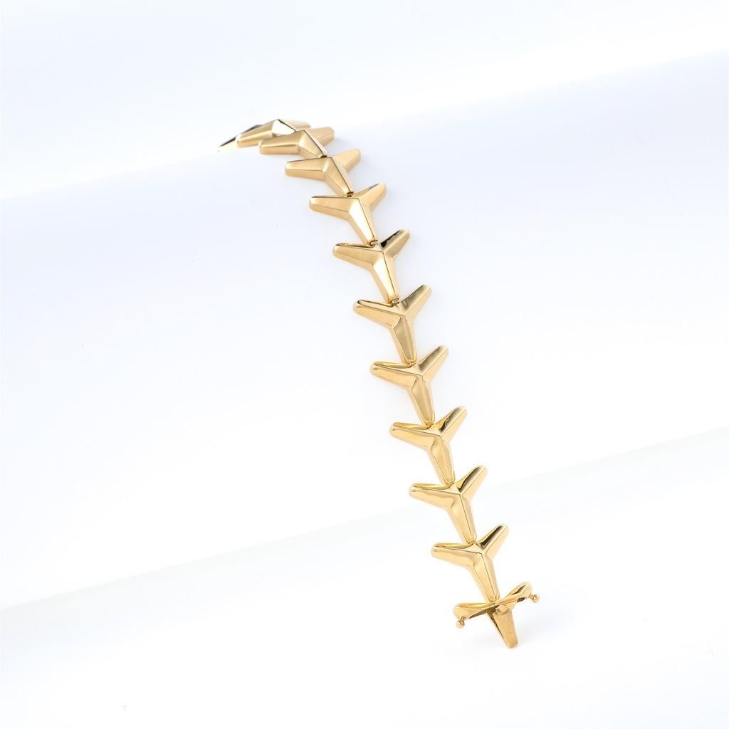 The Three pointed star, bracelet is crafted in 18K yellow gold hallmarked in Cyprus. This stunning articulated bracelet, comes in a highly polished finish. Its double secured box and tongue closure make it practical, comfortable and easy to wear.