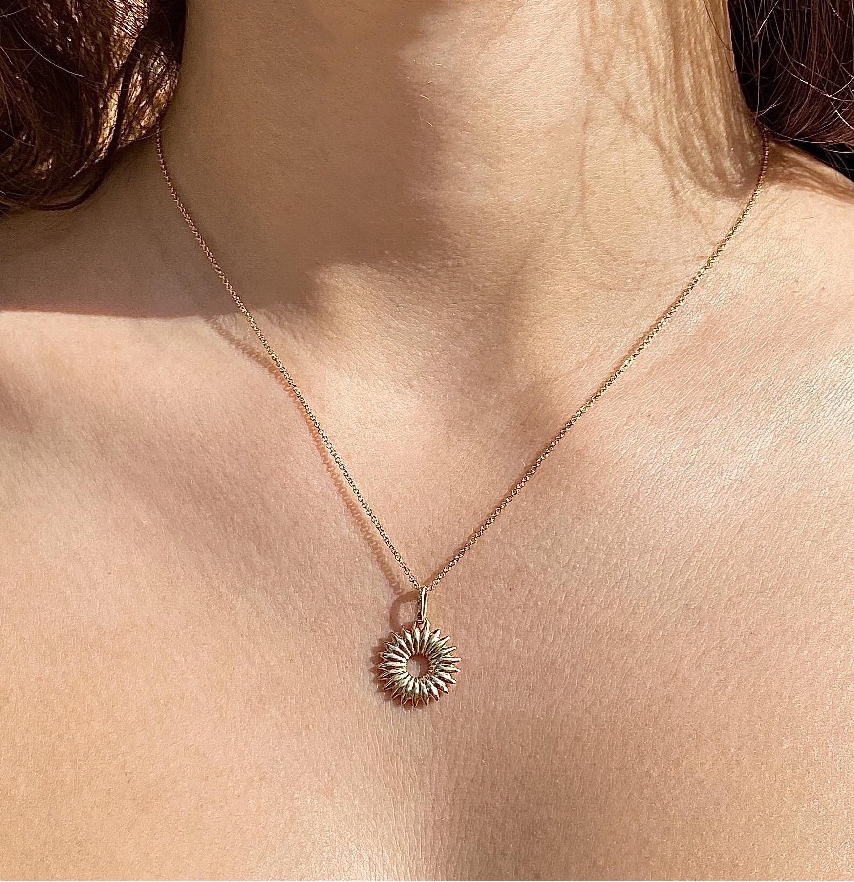 The Wreath of life, charm for 2021 is crafted in 18K gold hallmarked in Cyprus. This minimalist, statement charm necklace, comes in a highly polished finish and is attached on a standard 40 cm long, round link chain.
The Wreath of life, charm takes