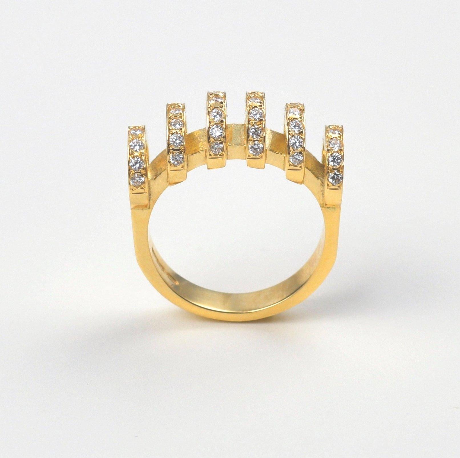 The ‘Parallel’ ring is crafted in 18K yellow gold, hallmarked in Cyprus. This elegant sophisticated diamond ring comes in a highly polished finish and features white, VS Diamonds totaling 0,42 cts. It is very comfortable to wear and will look