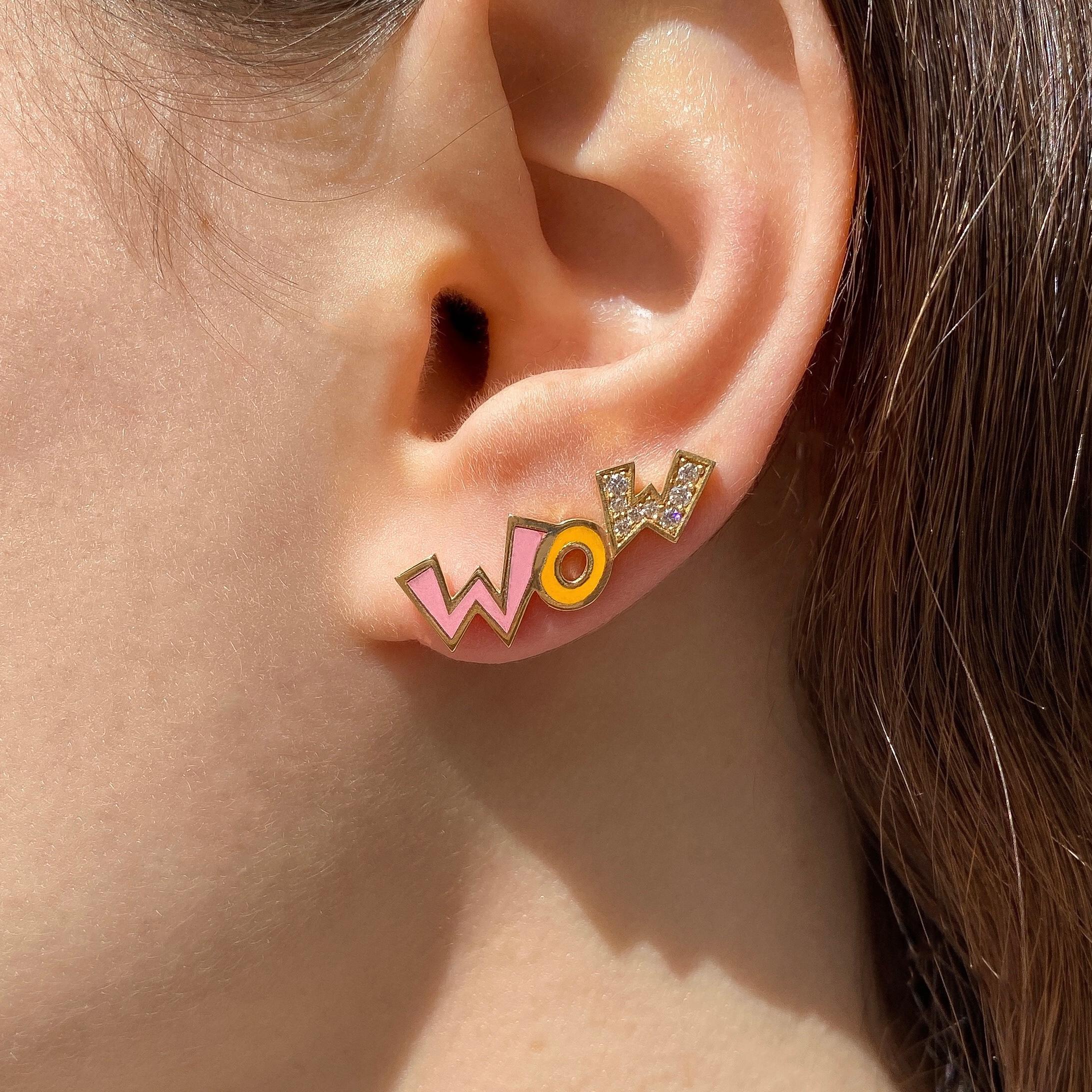 The Wow, ear climbers are crafted in 18K yellow gold, hallmarked in Cyprus. These fun and colourful climbers come in a highly polished finish and feature pink and yellow enamel as well as 0.2 cts of white Diamonds. They are very comfortable on the