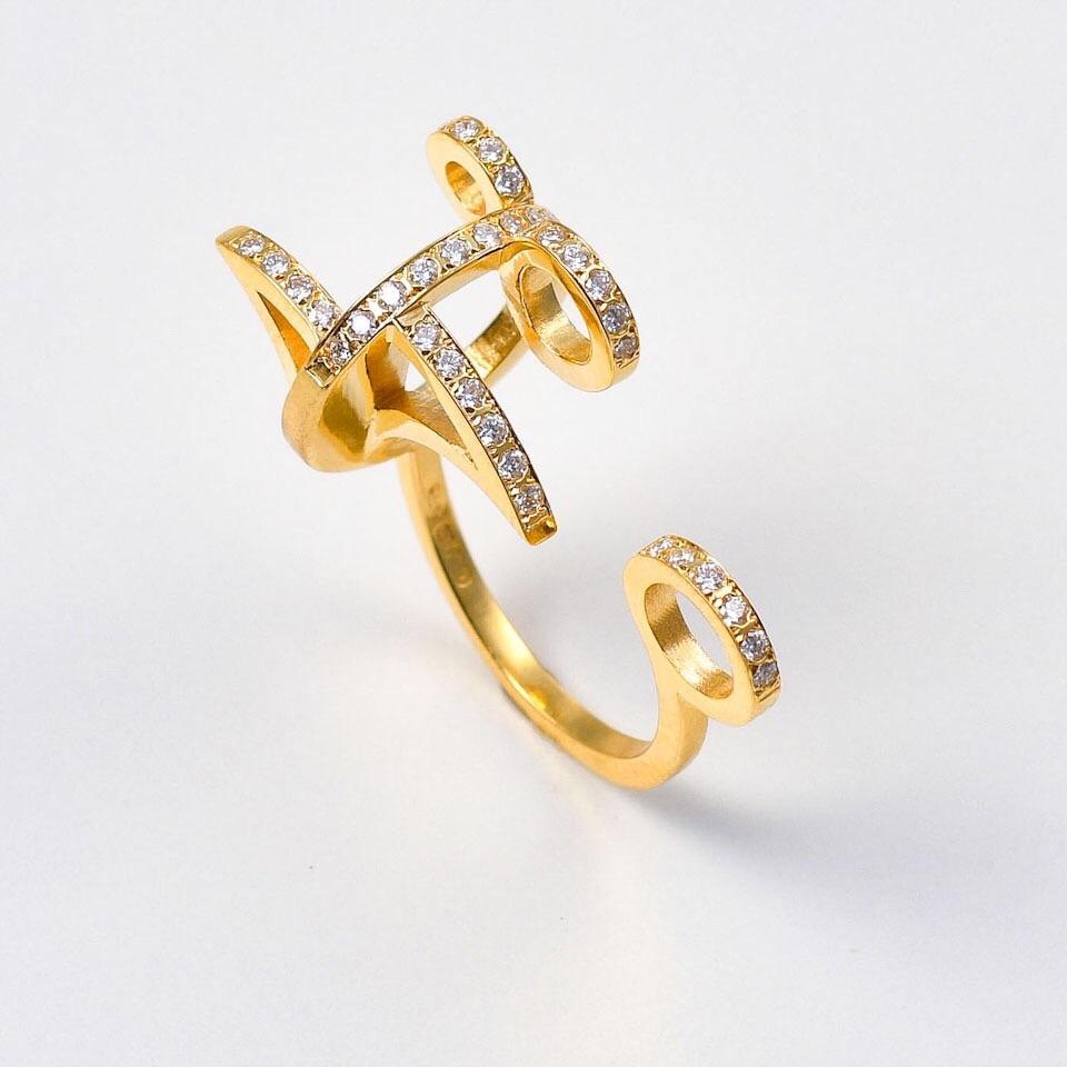 The 'Traces’, ring is crafted in 18k gold, hallmarked in Cyprus. This discretely elegant, sculptural ring comes in a highly polished finish and features white, VS Diamonds, totaling 0,35 Cts. The 'Traces’ ring is part of Maria Kotsonis’s