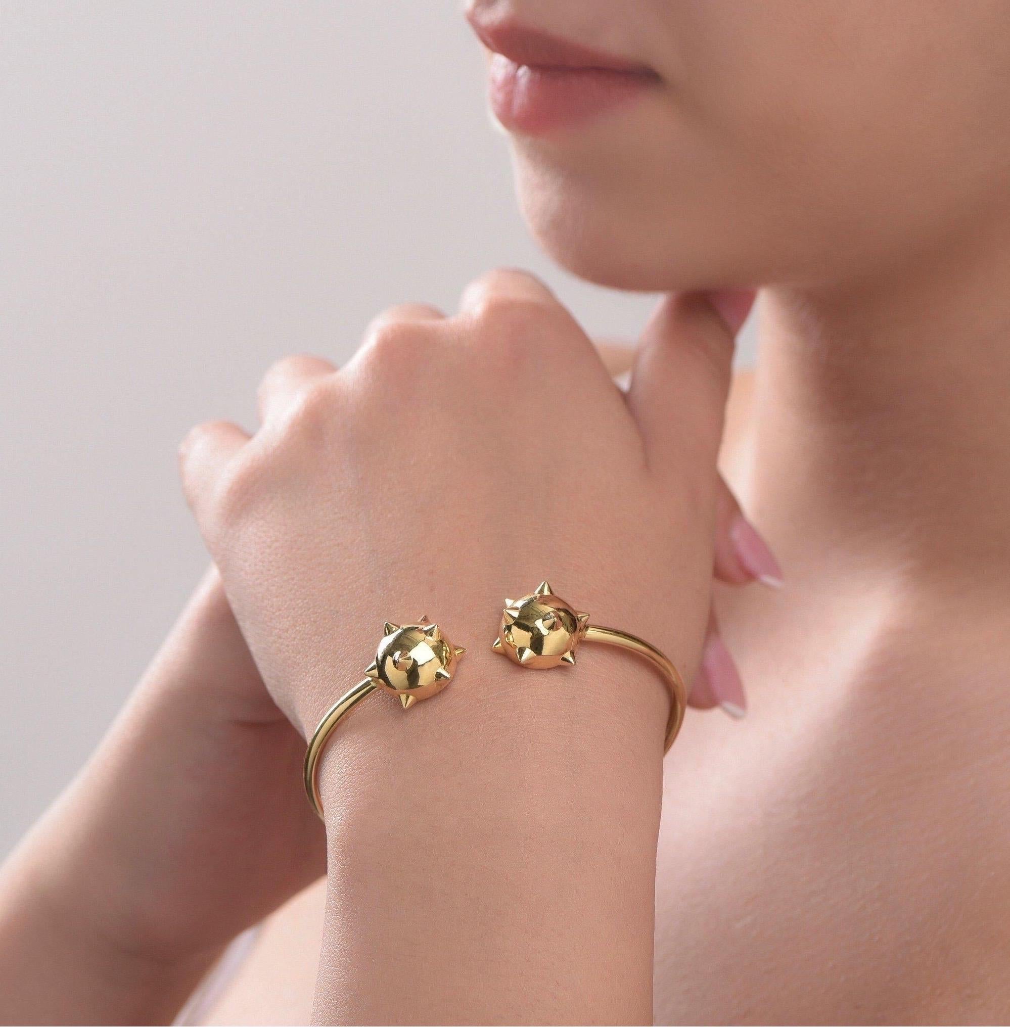 The ‘Morning Star’ flexible cuff is crafted in 18K yellow gold, hallmarked in Cyprus. This impressive cuff bracelet, comes in a highly polished finish and is composed of sculptural parts and flexible tube which makes it very comfortable and easy to