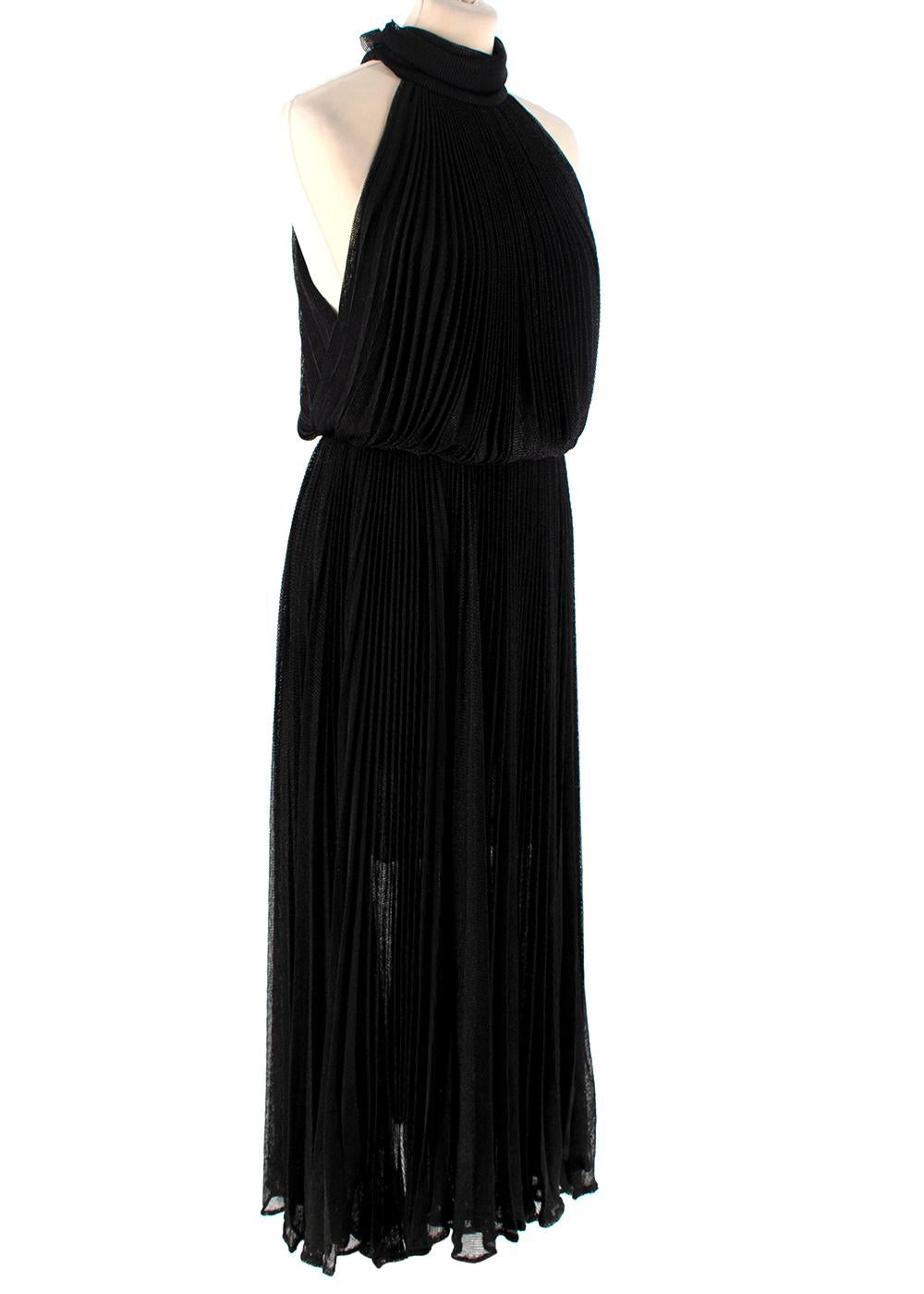 Maria Lucia Hohan Black Lurex Knit Pleated Dress

- Sleeveless
- High-neck
- Open back
- Button closure at the nape and concealed zip closure at the back 
- Elasticated waistband
- Fully lined

Materials:
59% Viscose
40% Lurex
1% Spandex

Dry clean