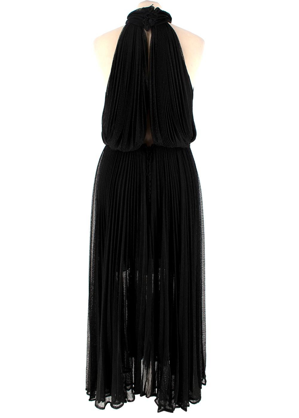 maria lucia hohan's fashion campaign featuring black dress
