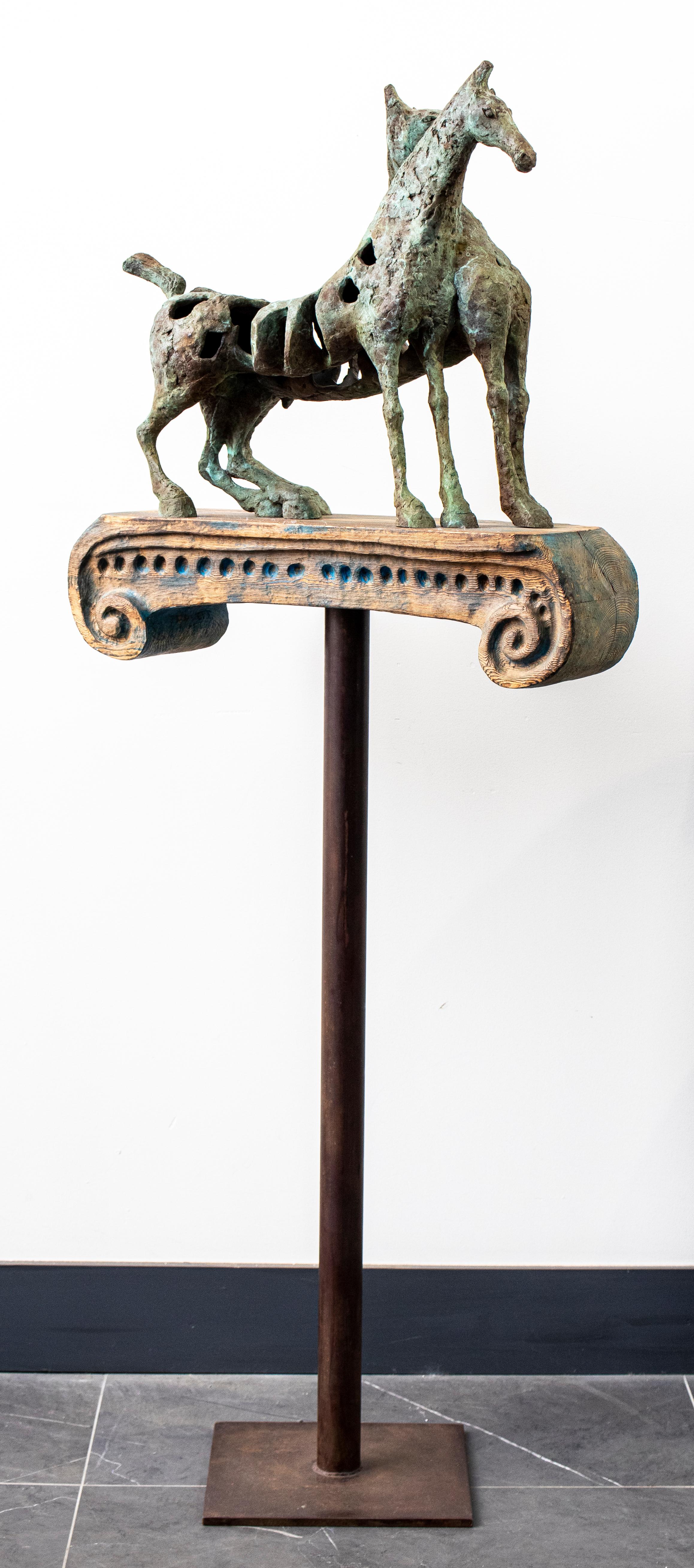 Maria Luisa Campoy (Spanish b.1945) Modernist bronze sculpture of two inter bodied horses atop a stylized carved wood ionic chapter, mounted on a metal stand, signed 'L. Campoy 3/8'. 62.5