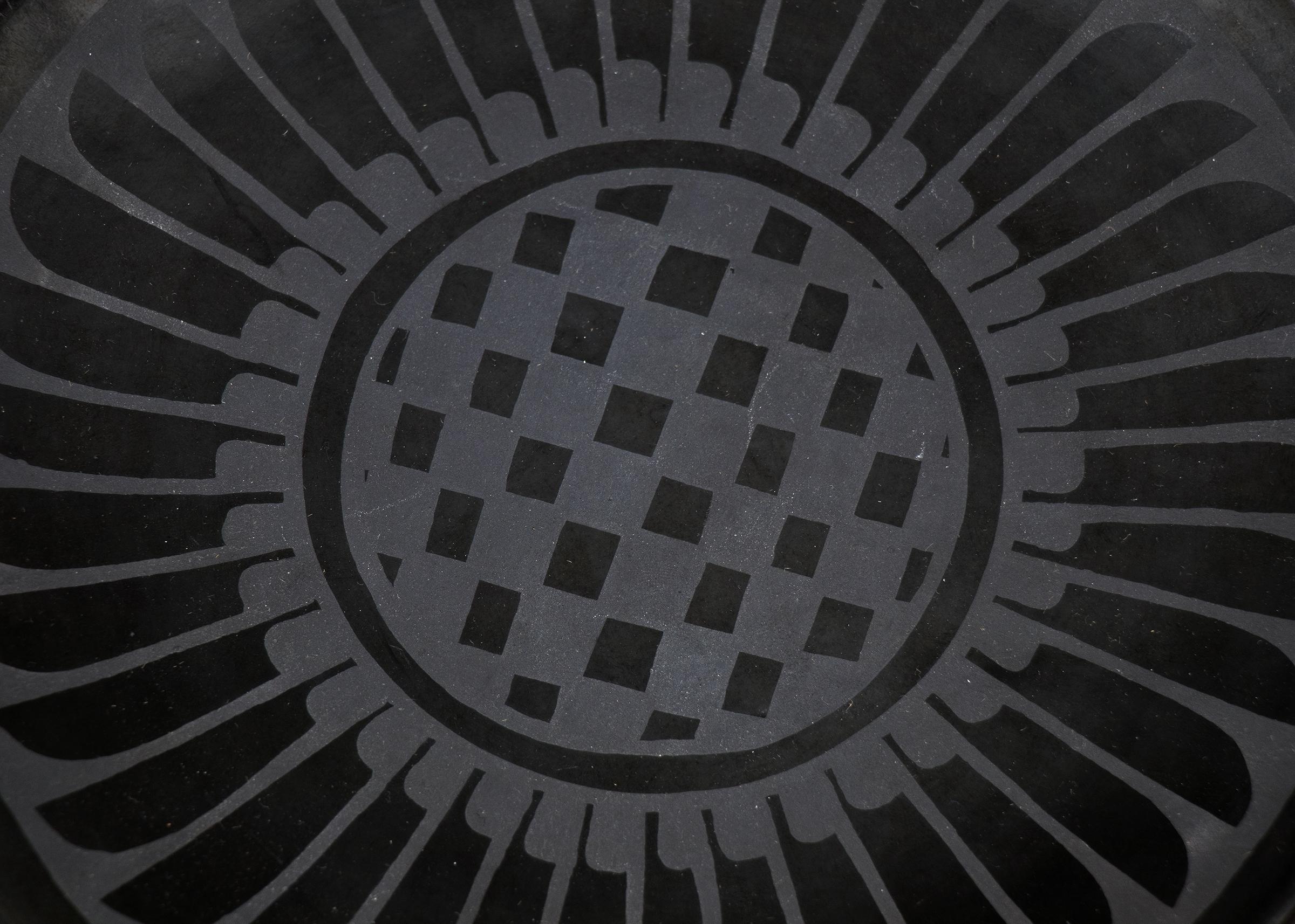 A blackware plate with feather motif by San Ildefonso Pueblo potter, Maria Poveka Martinez (1887-1980) and Santana, signed 