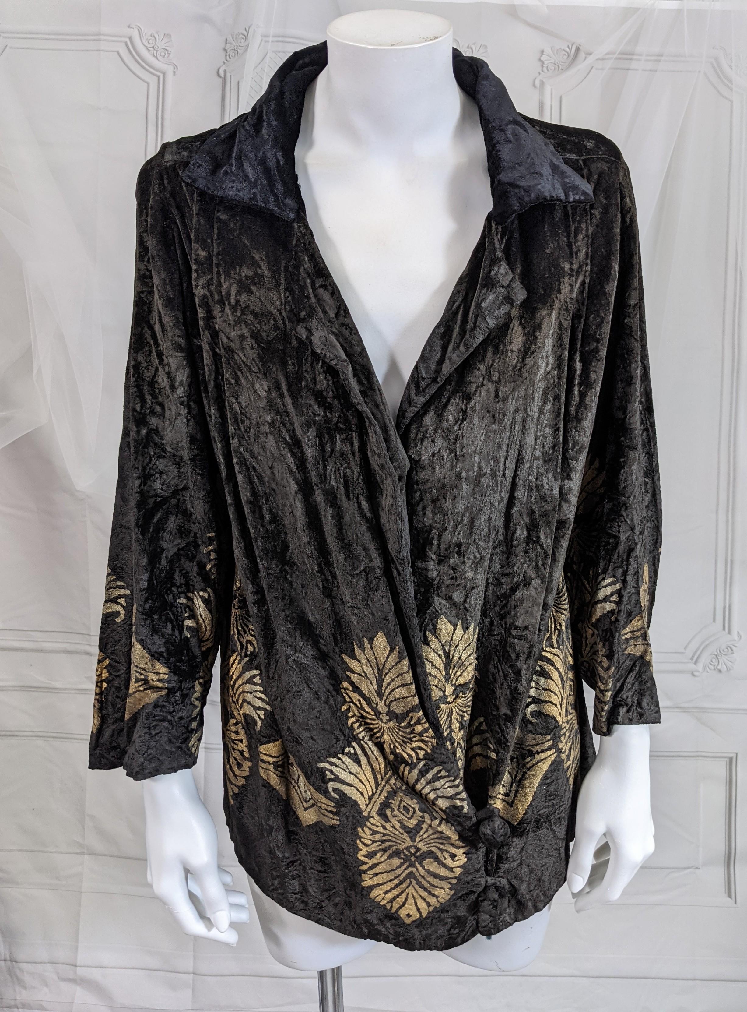 Maria Monaci Gallenga 1920's gauffered black silk velvet evening jacket. Stenciled with a Medieval foliate motif  and Renaissance palmettes in signature silver and gold leaf. Wrap style with velvet collar and Chinese inspired frog velvet buttons.