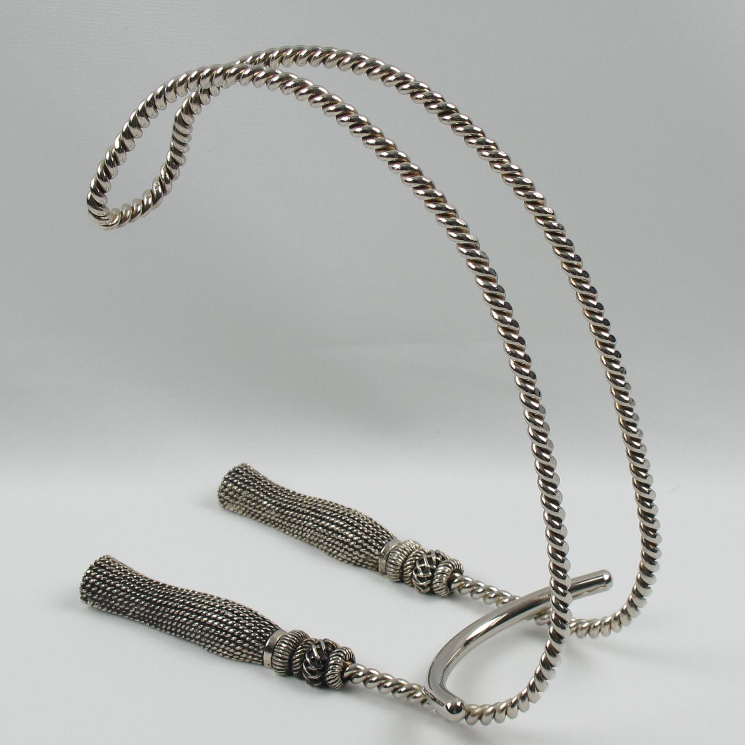 This stunning French wine bottle holder, pourer, or caddy, crafted from silver-plated metal, features an elegant shape with a base adorned with two large tassels and rope carving. The classic and refined constructed design is reminiscent of Maria