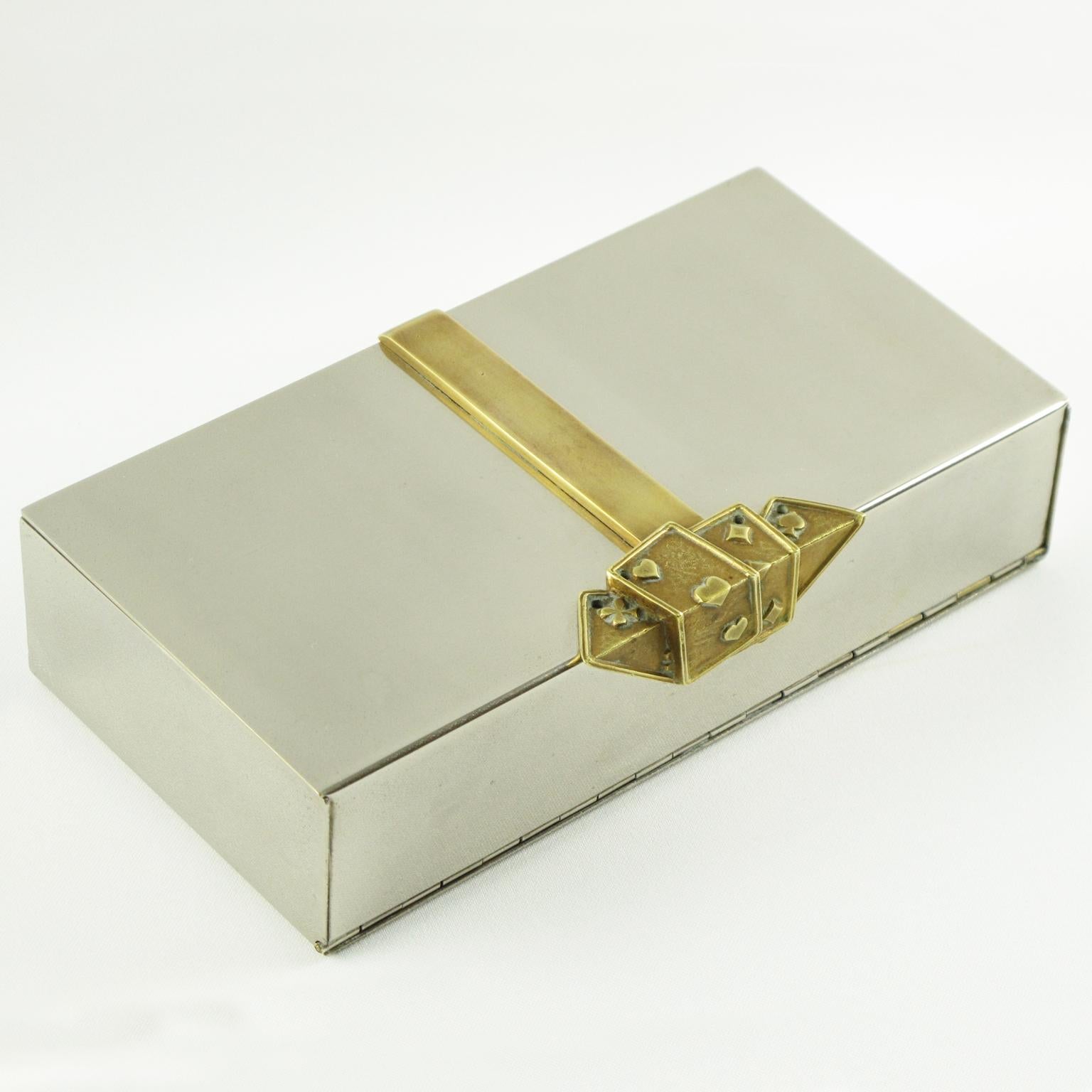Elegant modernist 1960s stainless steel and brass decorative box reminiscent of French designer Maria Pergay's work. Streamline rectangular shape with brass accent featuring gambling cards. Interior in wood with folding opening. No visible maker's