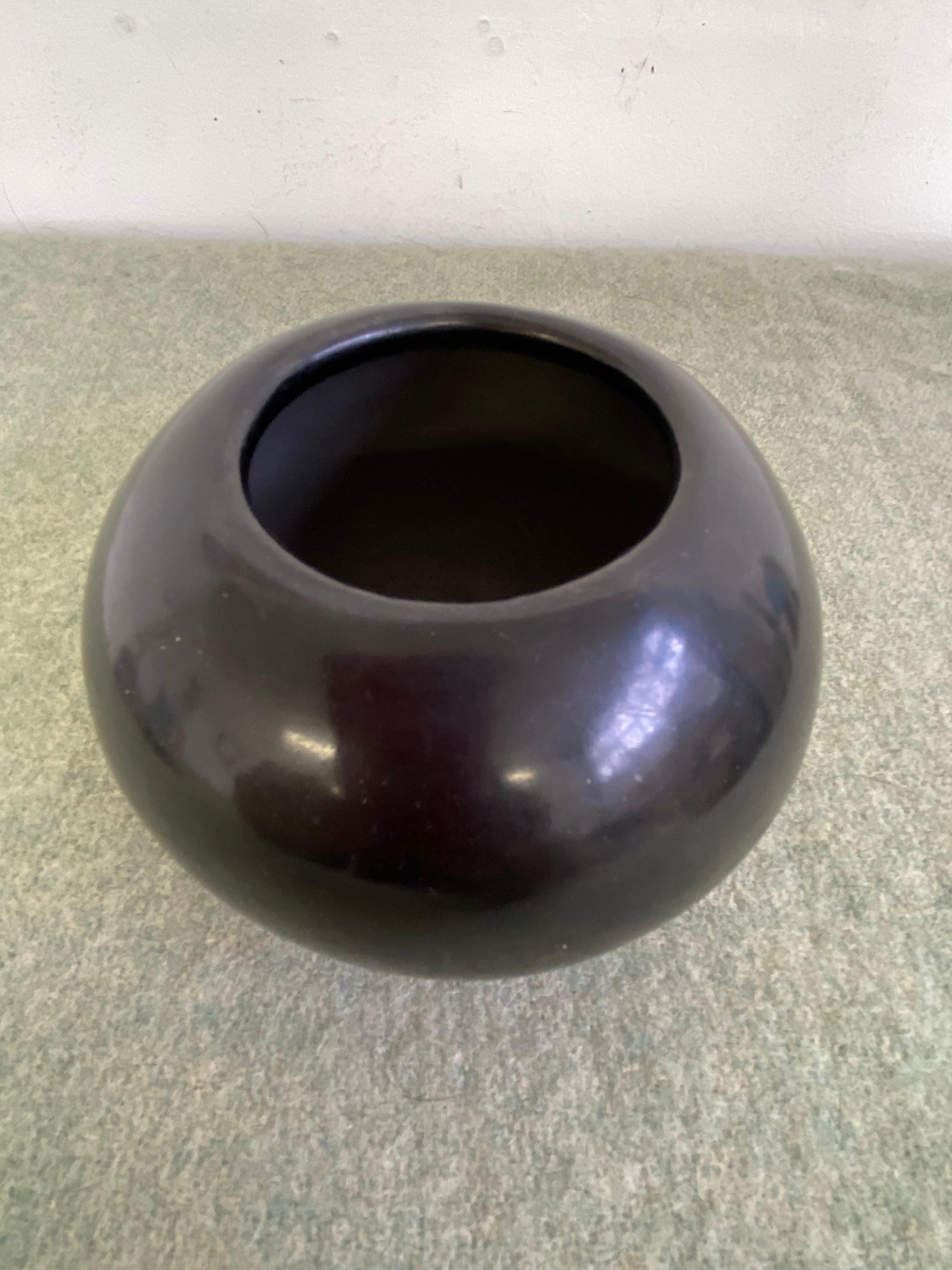 Maria Poveka (1887-1980) Native Clay with Traditional San Ildefonso Black Slip. Polished to a Medium High Finish. Signed Maria Poveka, pot dates to the 1950's. Maria the Potter of San Ildefonso, the most famous of the Pueblo Indian Potters who
