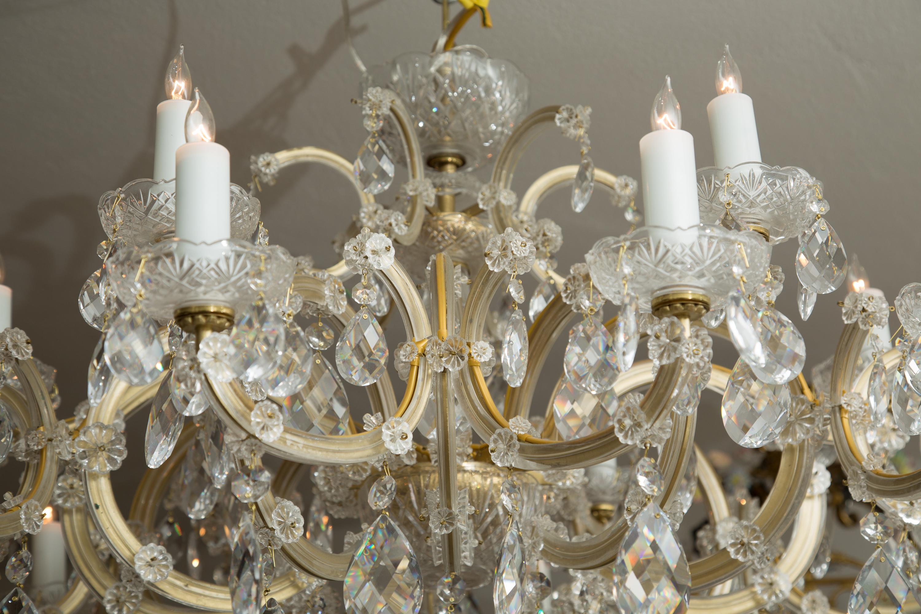 This is a classic Maria Theresa cut crystal chandelier that is shorter than most, allowing for rooms with somewhat low ceilings.