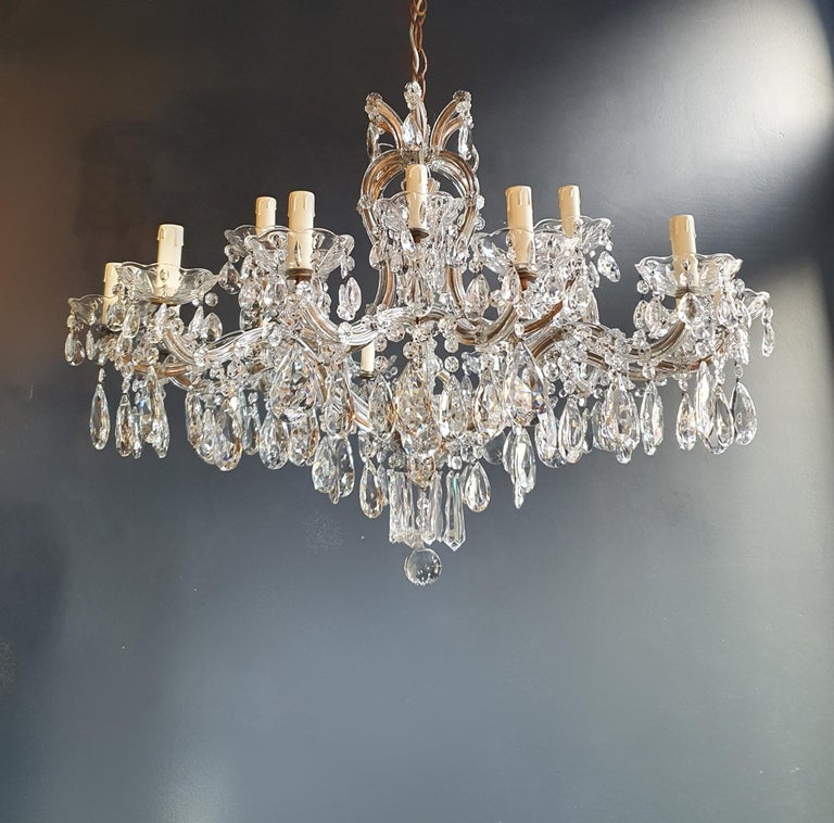 The frame is fully dressed all-over with glass. Cut crystal drops of different dimensions and shapes are hanging all-over the octagonal button chains, all around the chandelier.

Measures: Total height 150 cm, height without chain 75 cm, diameter