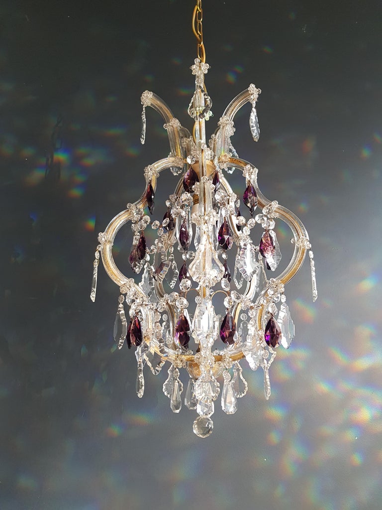 The frame is fully dressed all-over with glass. Cut crystal drops of different dimensions and shapes are hanging all-over the octagonal button chains, all around the chandelier.

Measures: Total height 130 cm, height without chain 65 cm, diameter