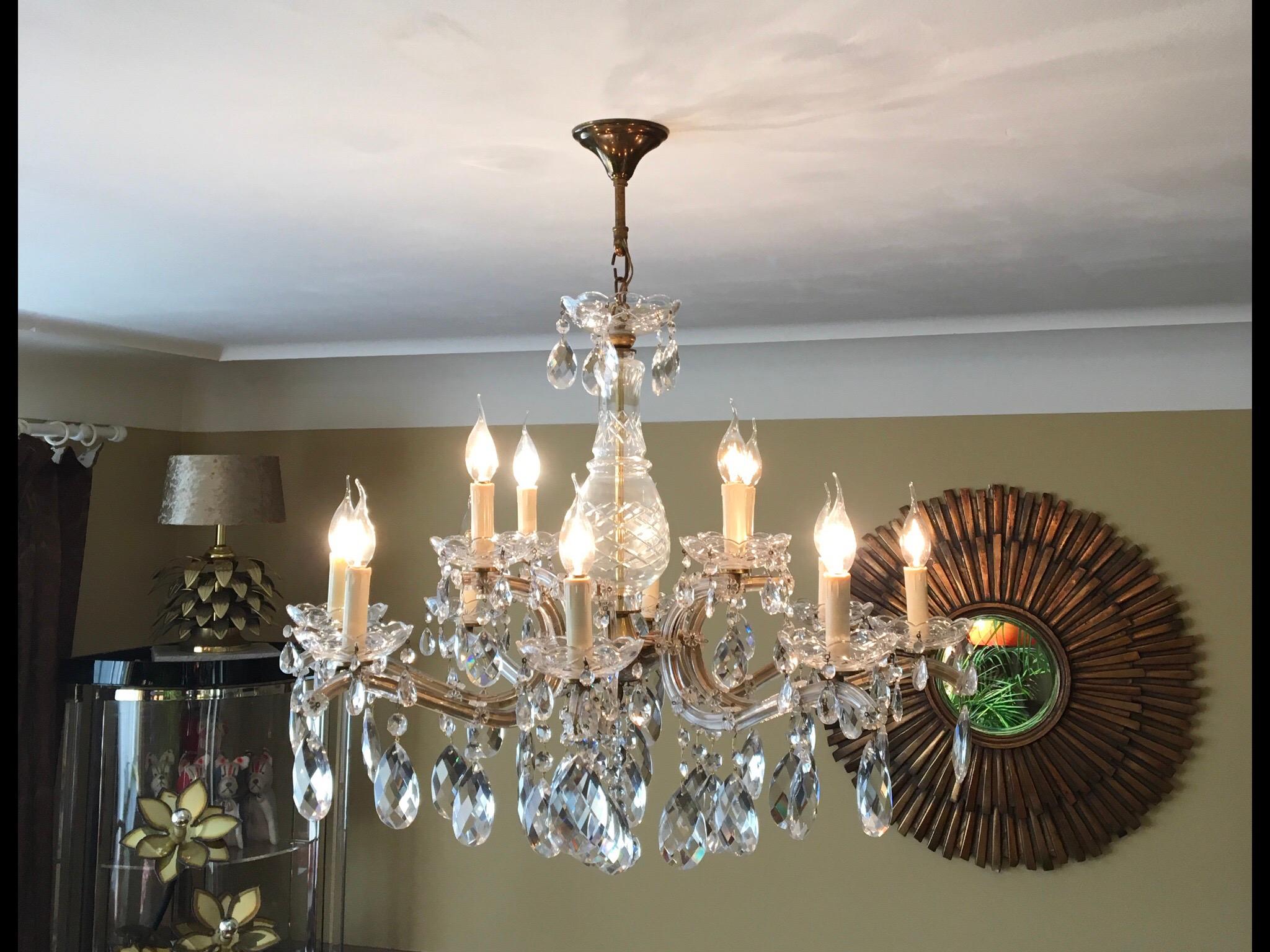 Elegant large Crystal Chandelier Maria Theresa style with 12 lights.
The frame is covered in crystal glass with hanging crystal pendants.
The clarity of the crystal along with the elaborate facet work of each drop,
gives this antique style