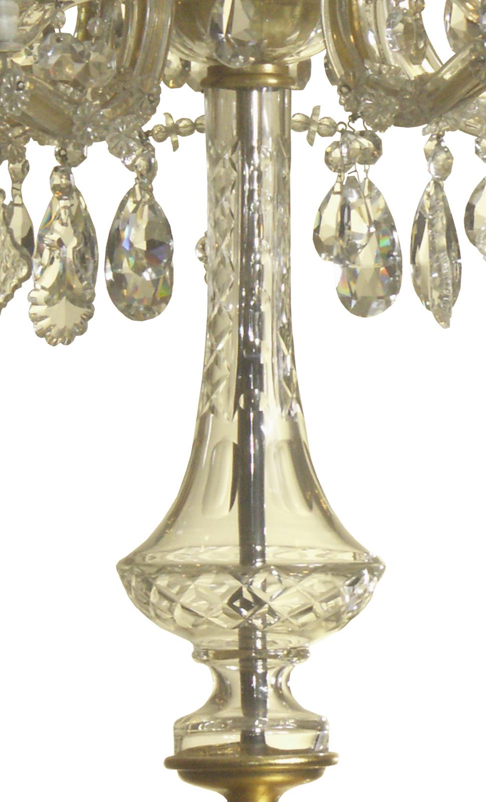 A typical fixture from the turn of the last century, circa 1900, wrought iron with glass-layers. In the centre a handblown and cut glass-vase.