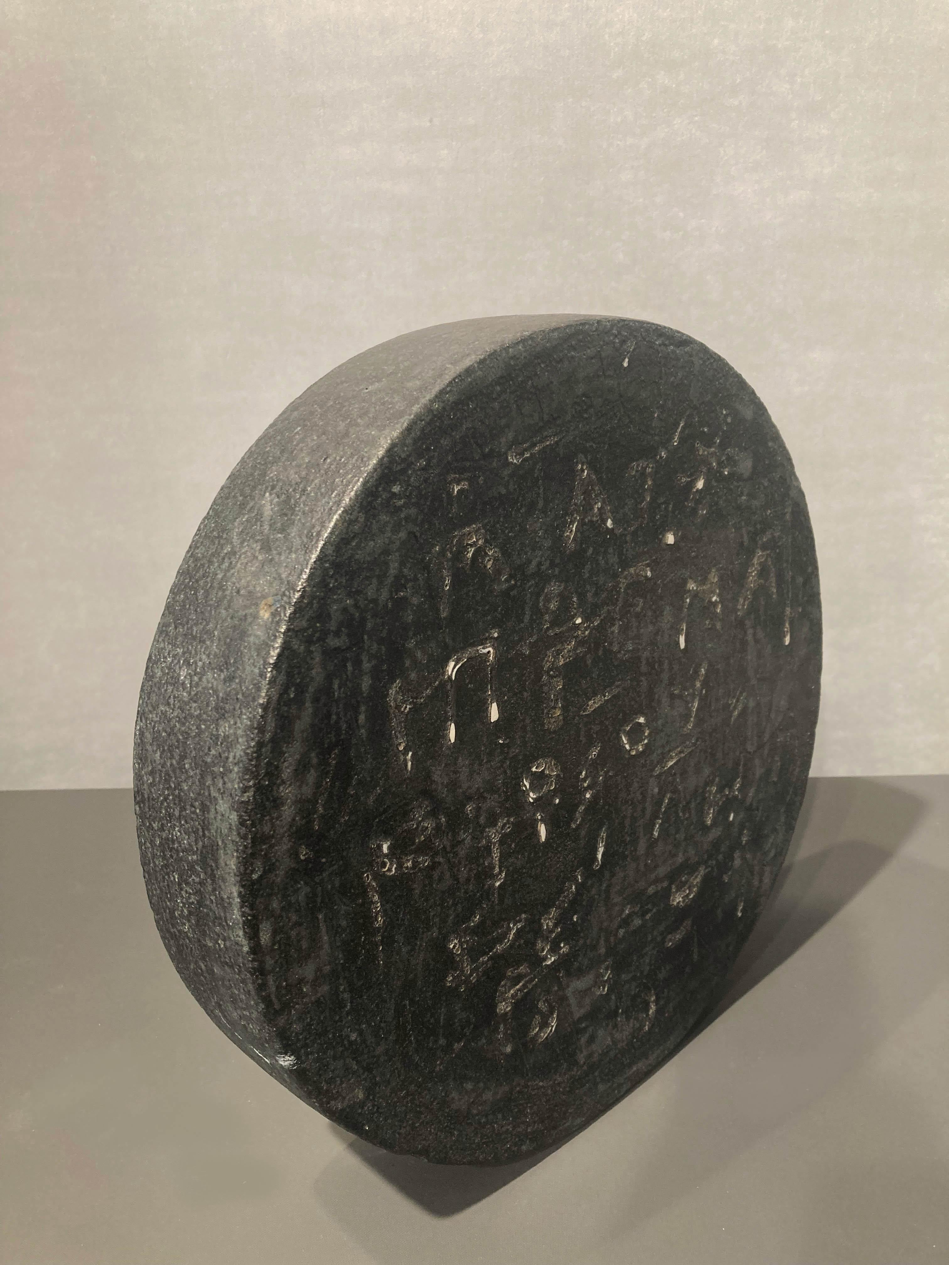 Black disk with symbols - Sculpture by Maria Vlandi