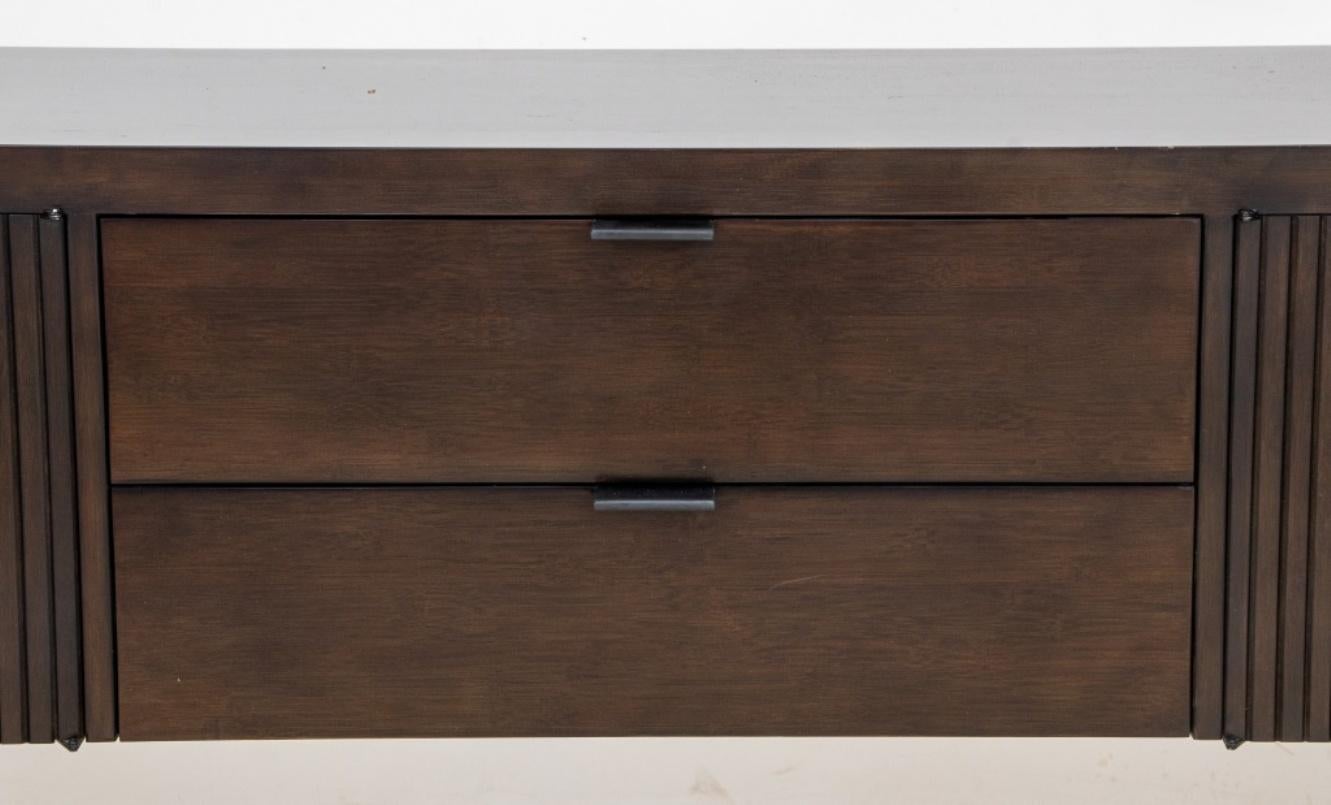 Maria Yee for Room & Board ebonized bamboo timbre credenza or side board raised on tapered legs, having two center drawers with metal handles flanked by two two doors cabinets, maker plate to inside. 34