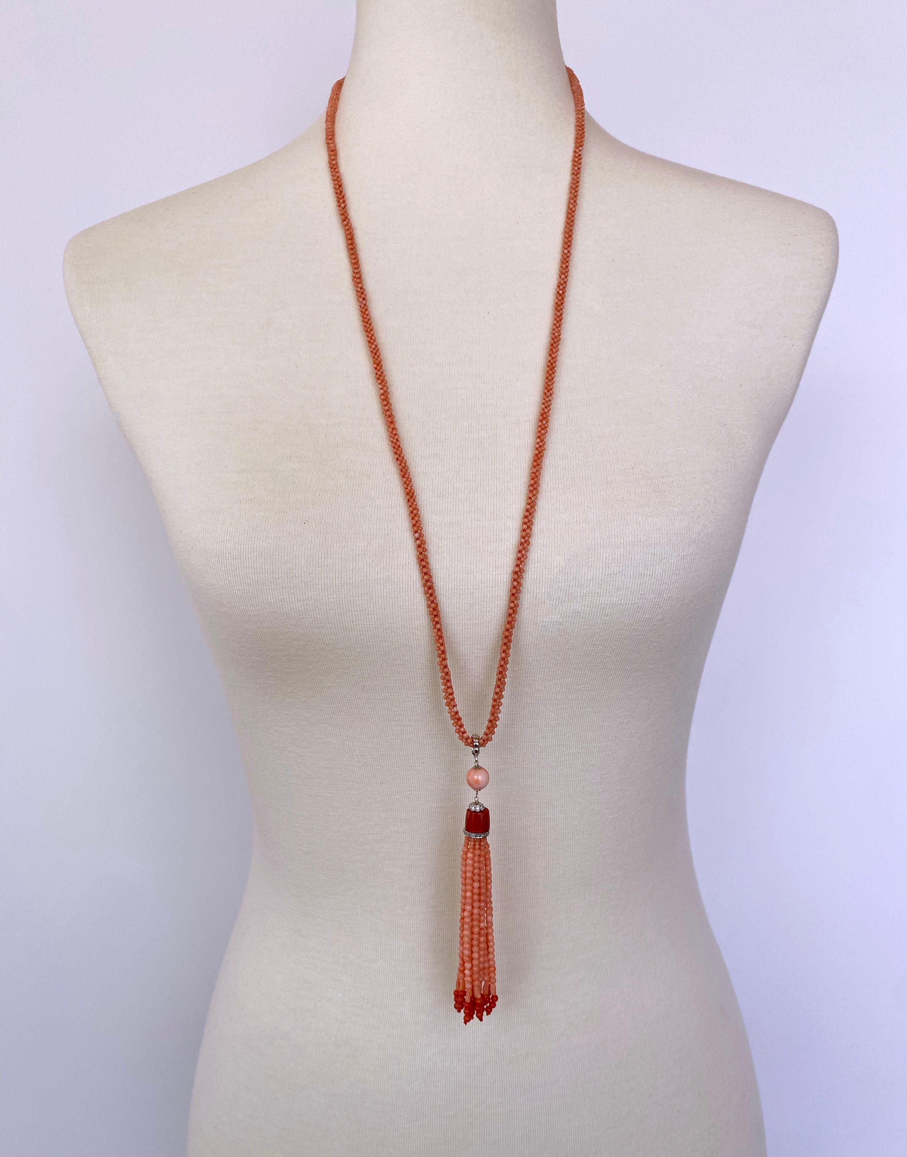 Hand woven necklace by Marina J. This great piece is made with small Mediterranean Coral beads which display a beautiful soft Pink/ Orange color, accented by deep Red Raw Mediterranean Coral and woven into a 3 dimensional rope. Measuring 33.75