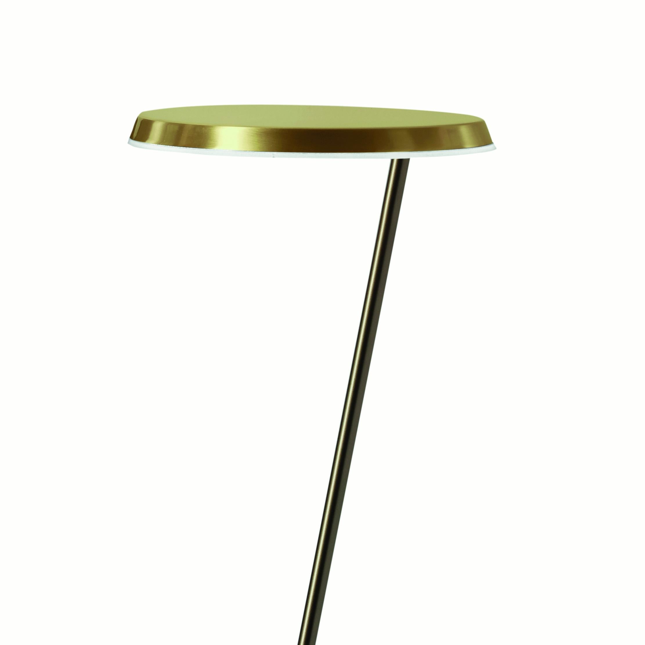 Floor lamp 'Amanita' designed by Mariana Pellegrino Soto in 1970.
Floor led lamp, with dimmable switch, giving direct light. Base and sloped stem in anodic bronze, adjustable reflector in satin gold. PMMA transparent closing disk.
Manufactured by