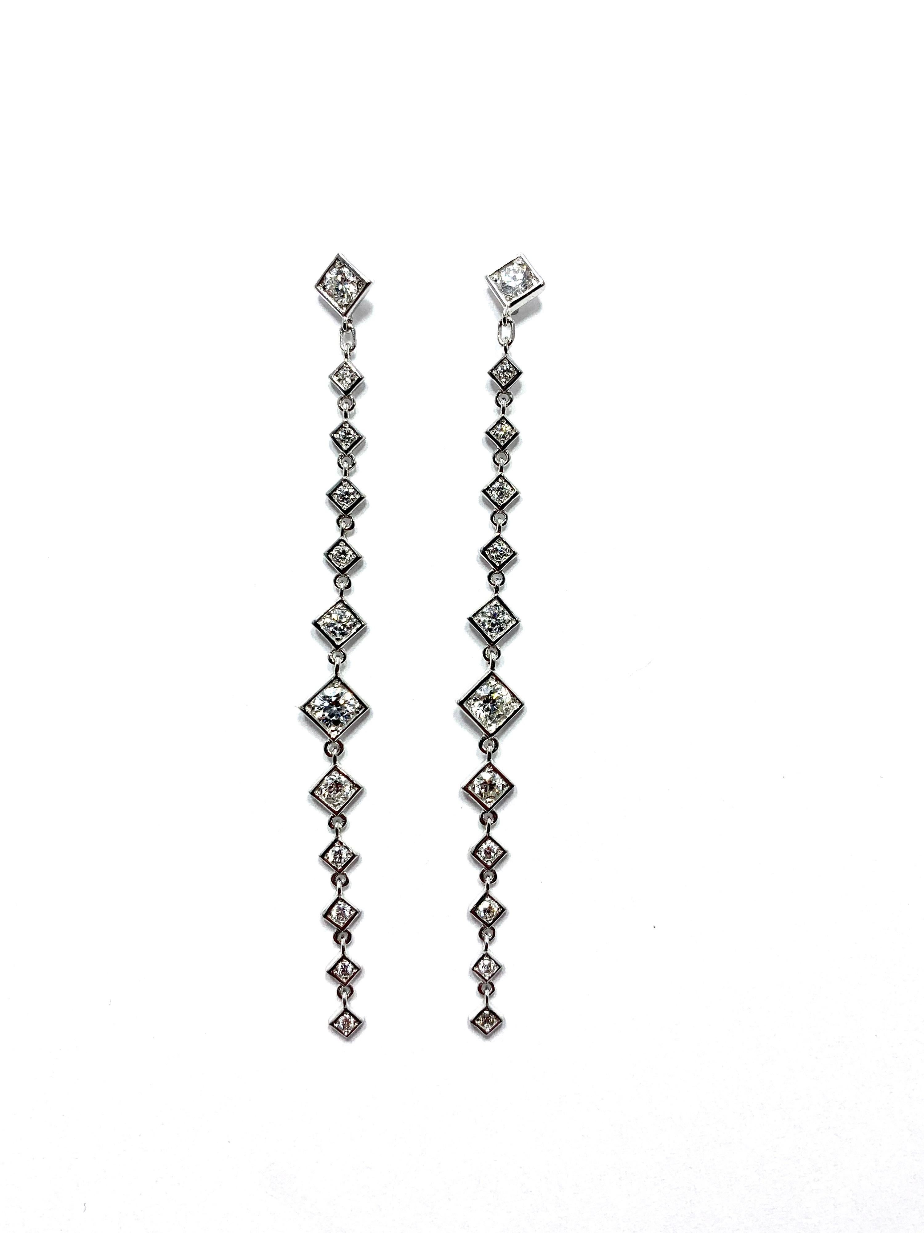 Handcrafted in Italy by Mariani Gioielli this stunning pair of Diamond drop earrings will light up the night!  The 24 round brilliant Diamonds have a total weight of 1.64 carats set in 18 karat white gold.  They are E/F color, VVS2 clarity.  The