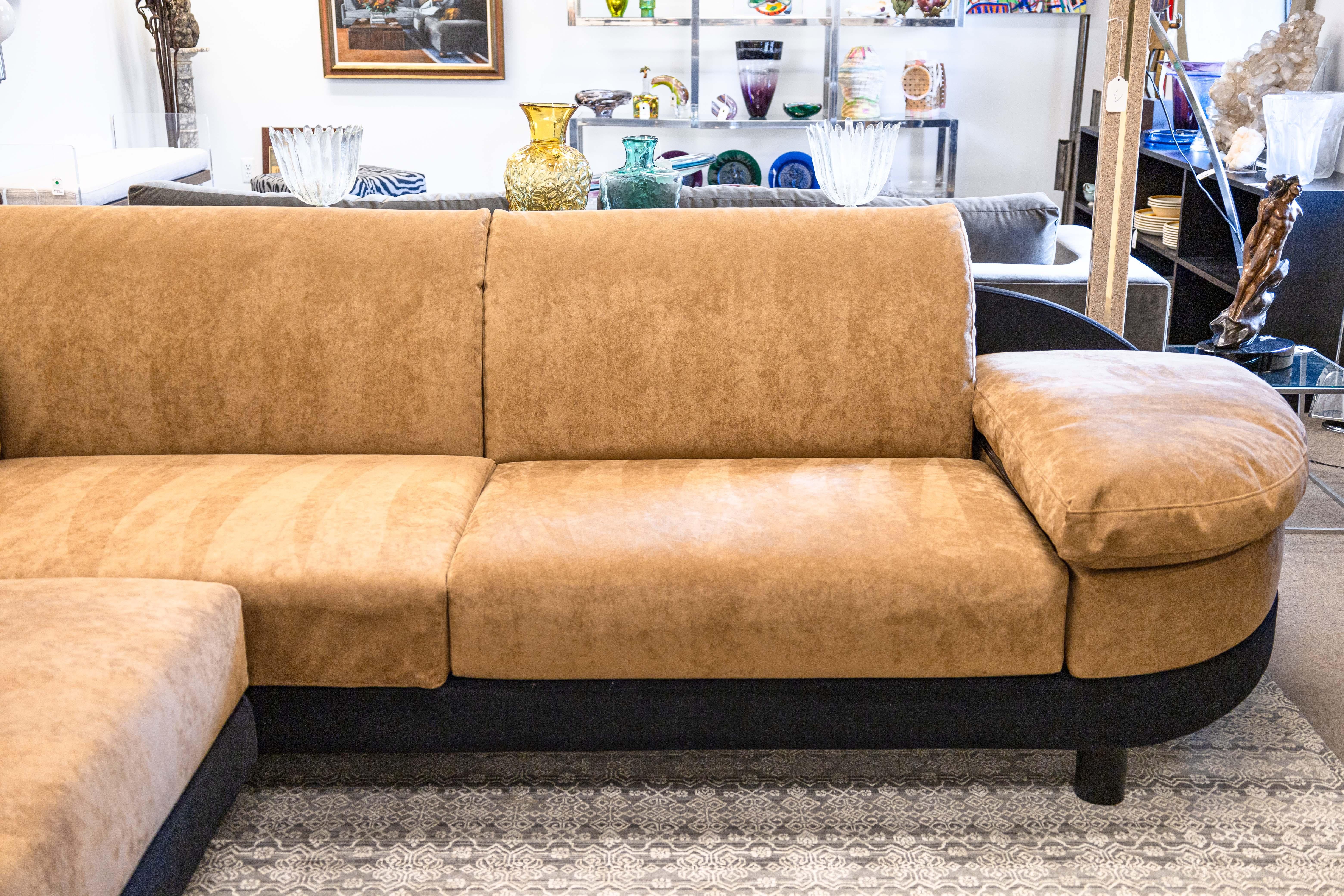A 2 piece sectional sofa by 14 Mariani for Pace. This stunning sectional features a standard 2 piece L-shaped design. Each side features a set of thick, removable back and seat cushions, which are super plush and comfy. Each end also receives a