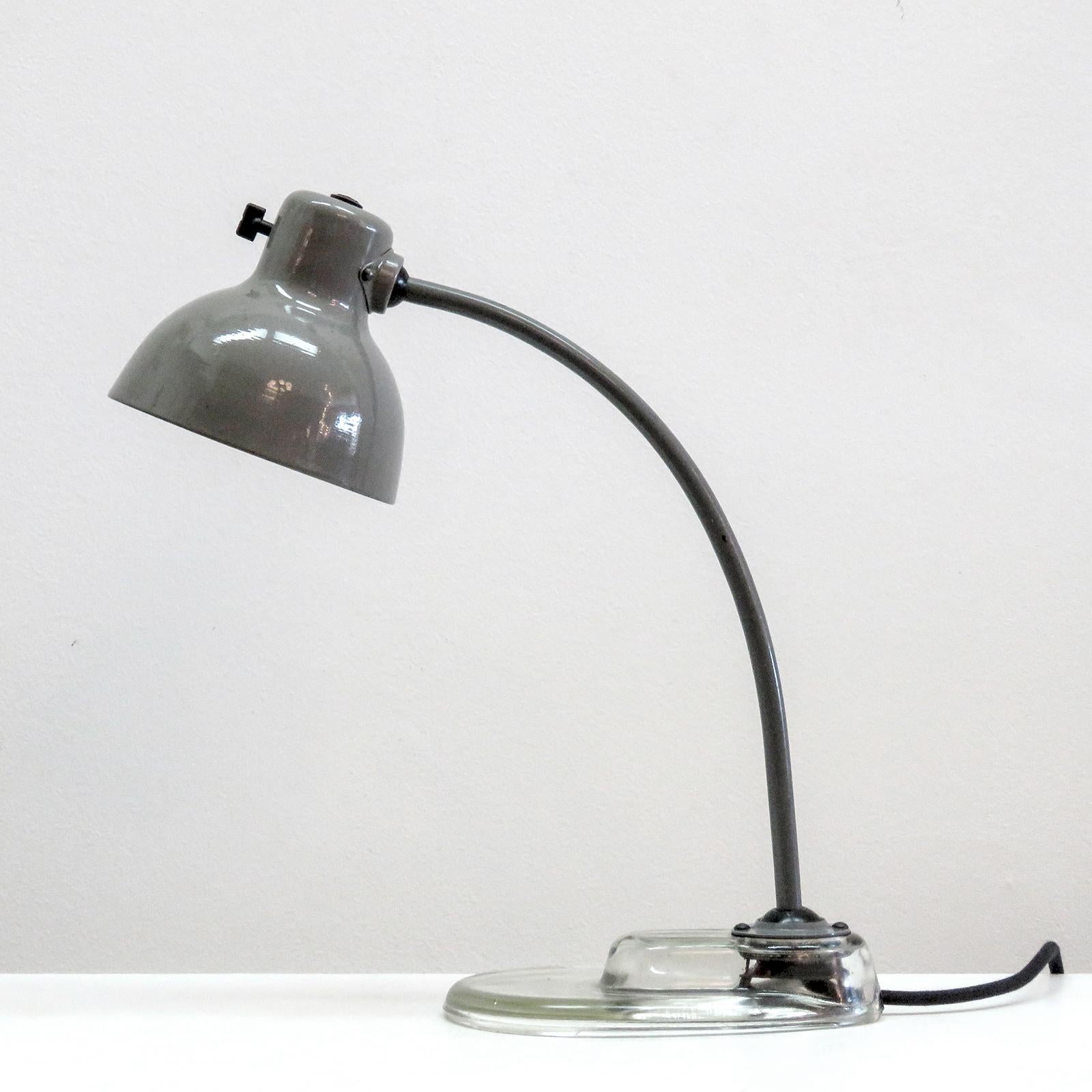 Stunning Kandem task lamps for Leuchtenbau Leipzig, post WWII Model manufactured with original Kandem No. 1115 parts, original light grey enameled metal shade and arm on a clear glass base, with individual on/off switch on the shade that was