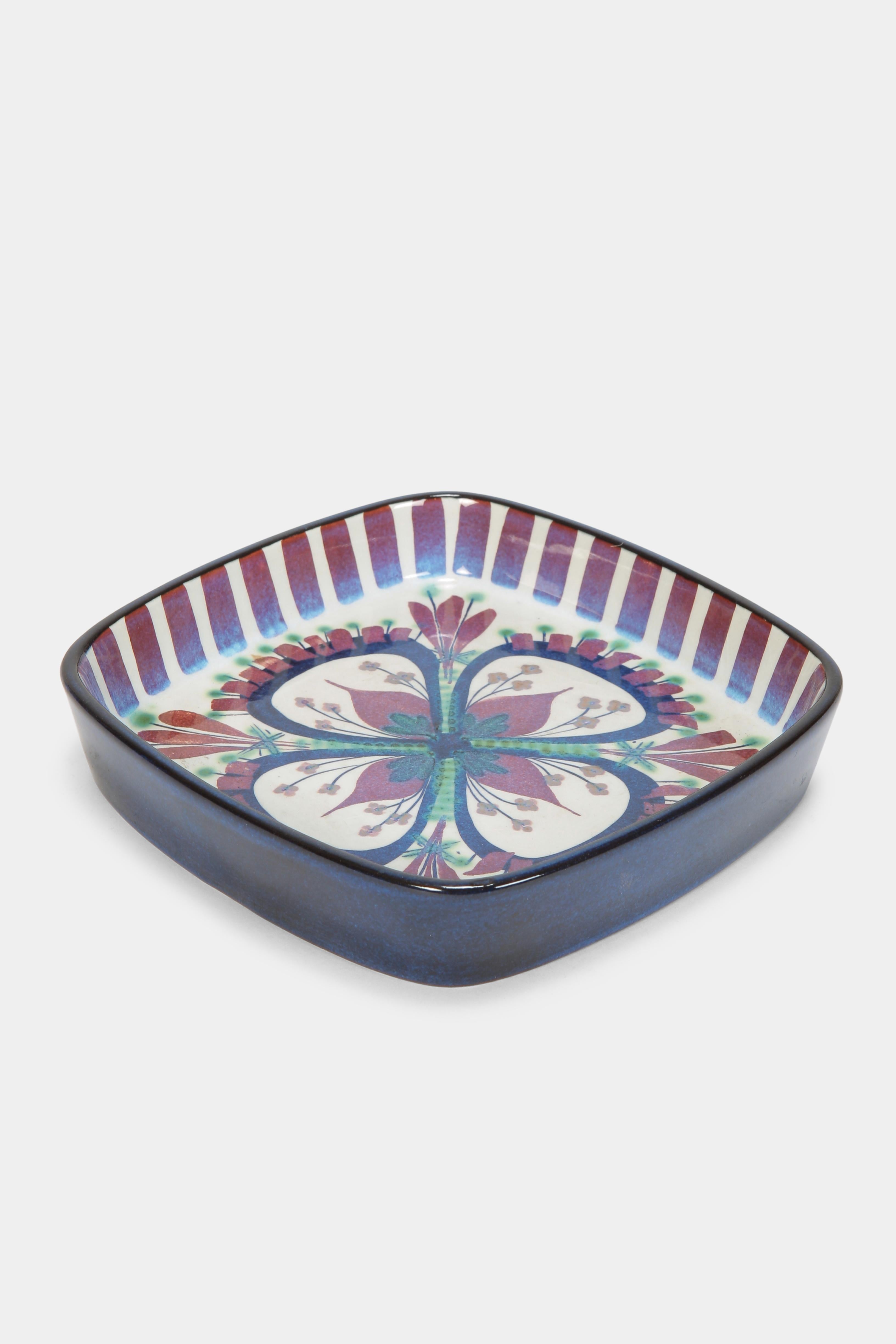 Marianne Johnson bowl manufactured by Royal Copenhagen in the 1969 in Denmark. Ceramic bowl colored with intensive shades, illuminating details and fluid transitions. Marked on the bottom with the initials of the designer and the number 174/2883.