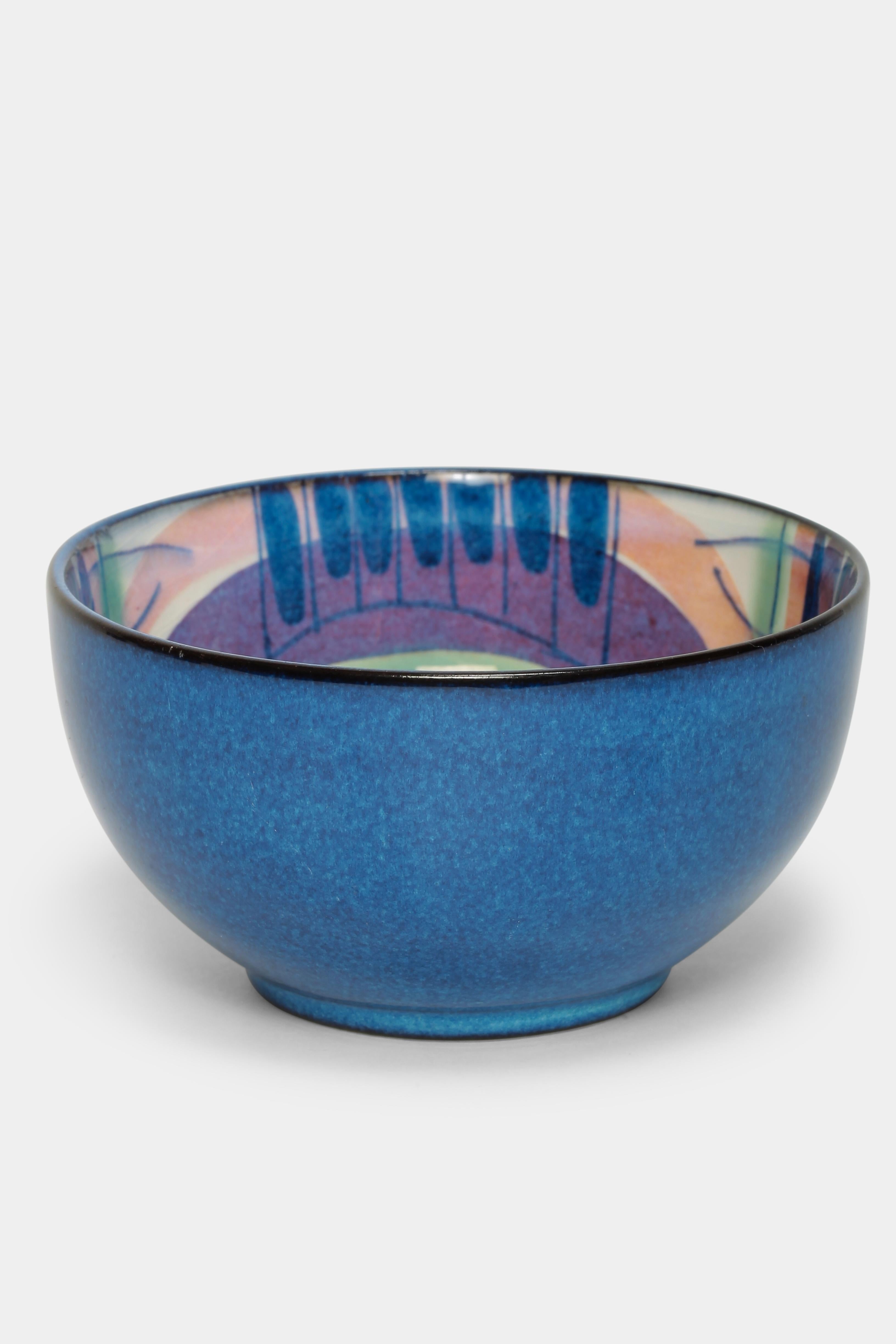 Marianne Johnson bowl made by Royal Copenhagen in the 1960s in Denmark. Painted ceramic bowl in with vibrant colors, bright details and flowing transitions. Marked at the bottom with the designer’s initials and numbered 137/2196.