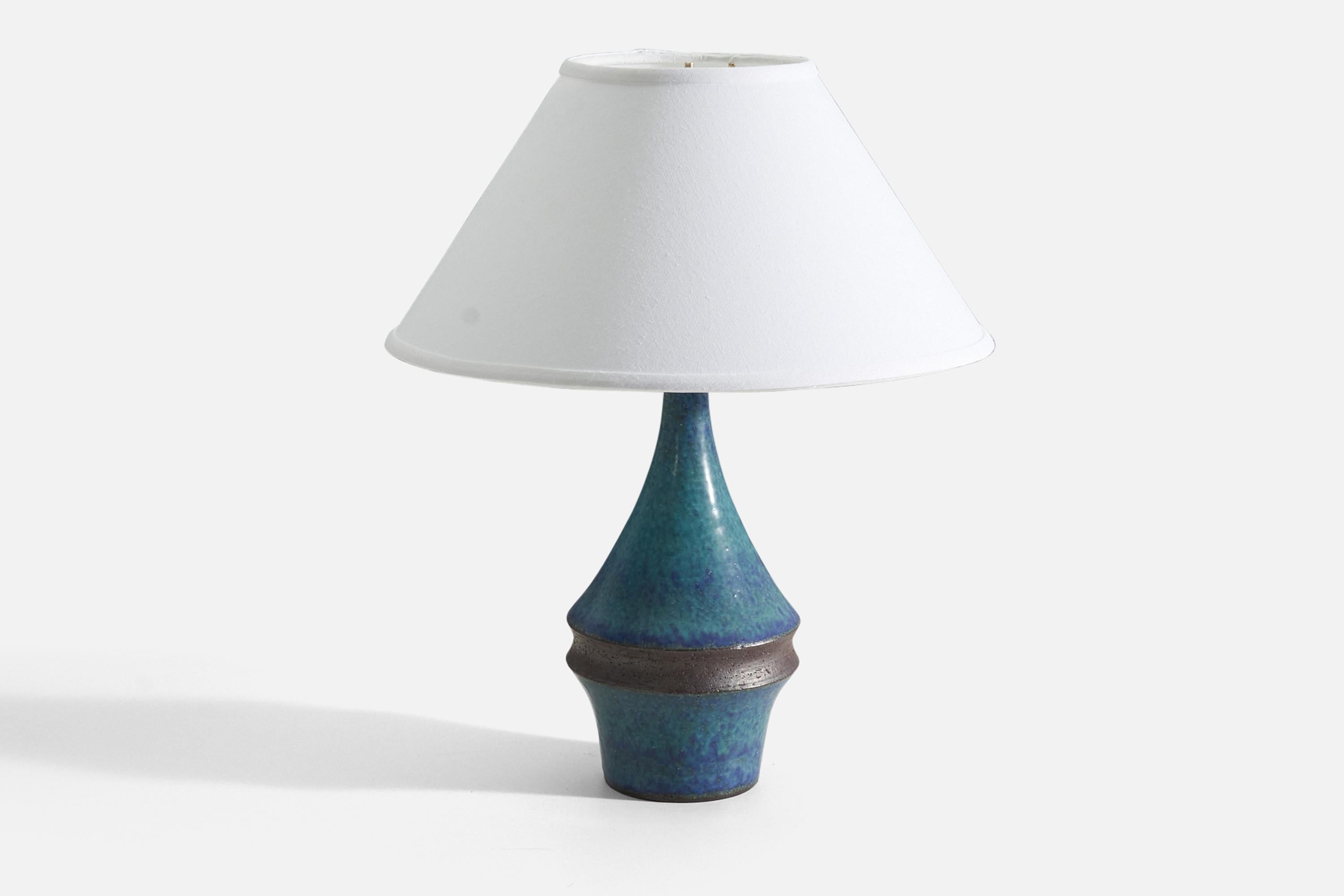 A table lamp designed by Marianne Starck produced by Michael Andersen Keramik. Signed and labeled.

Purchase excludes lampshade. Stated measurements excluding lampshade. Height includes socket with no lightbulb.

Glaze features a blue color.

Other