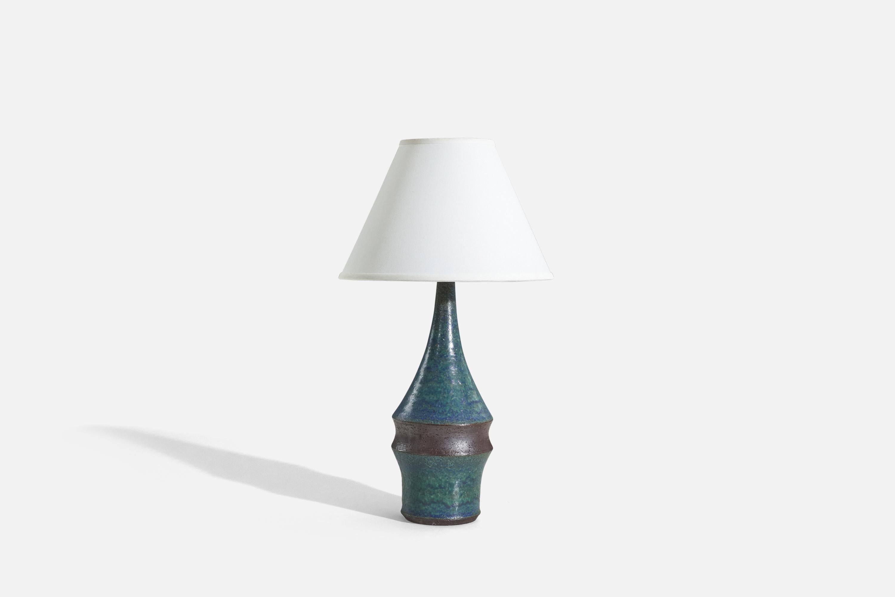 A blue, glazed stoneware table lamp designed by Marianne Starck and produced by Michael Andersen Keramik, Denmark, 1960s. 
 
