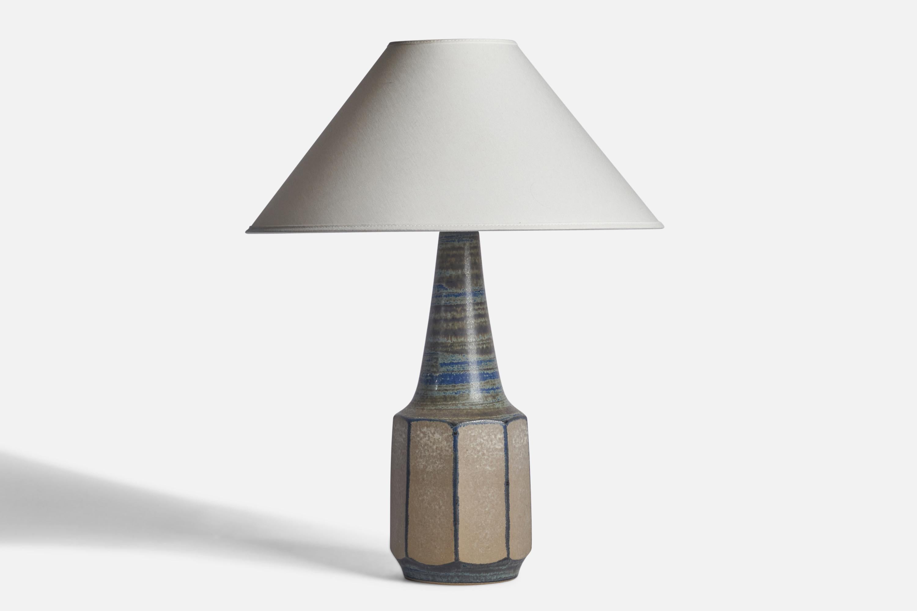 A blue-glazed stoneware table lamp designed by Marianne Starck and produced by Michael Andersen, Bornholm, Denmark, 1960s.

Dimensions of Lamp (inches): 16.25” H x 5.25” Diameter
Dimensions of Shade (inches): 4.5” Top Diameter x 16” Bottom Diameter