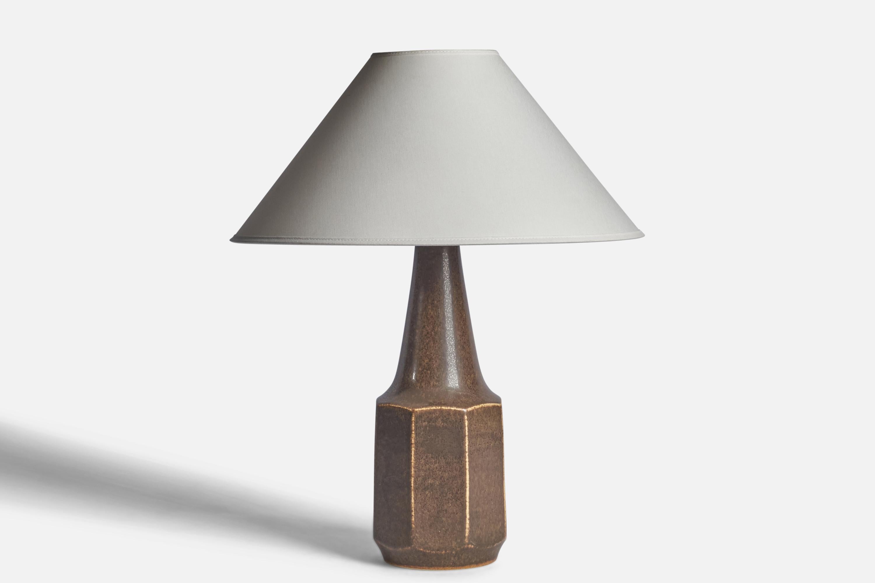 A brown-glazed stoneware table lamp designed by Marianne Starck and produced by Michael Andersen, Bornholm, Denmark, c. 1960s.

Dimensions of Lamp (inches): 15.5 H x 5” Diameter
Dimensions of Shade (inches): 4.5” Top Diameter x 16” Bottom Diameter x