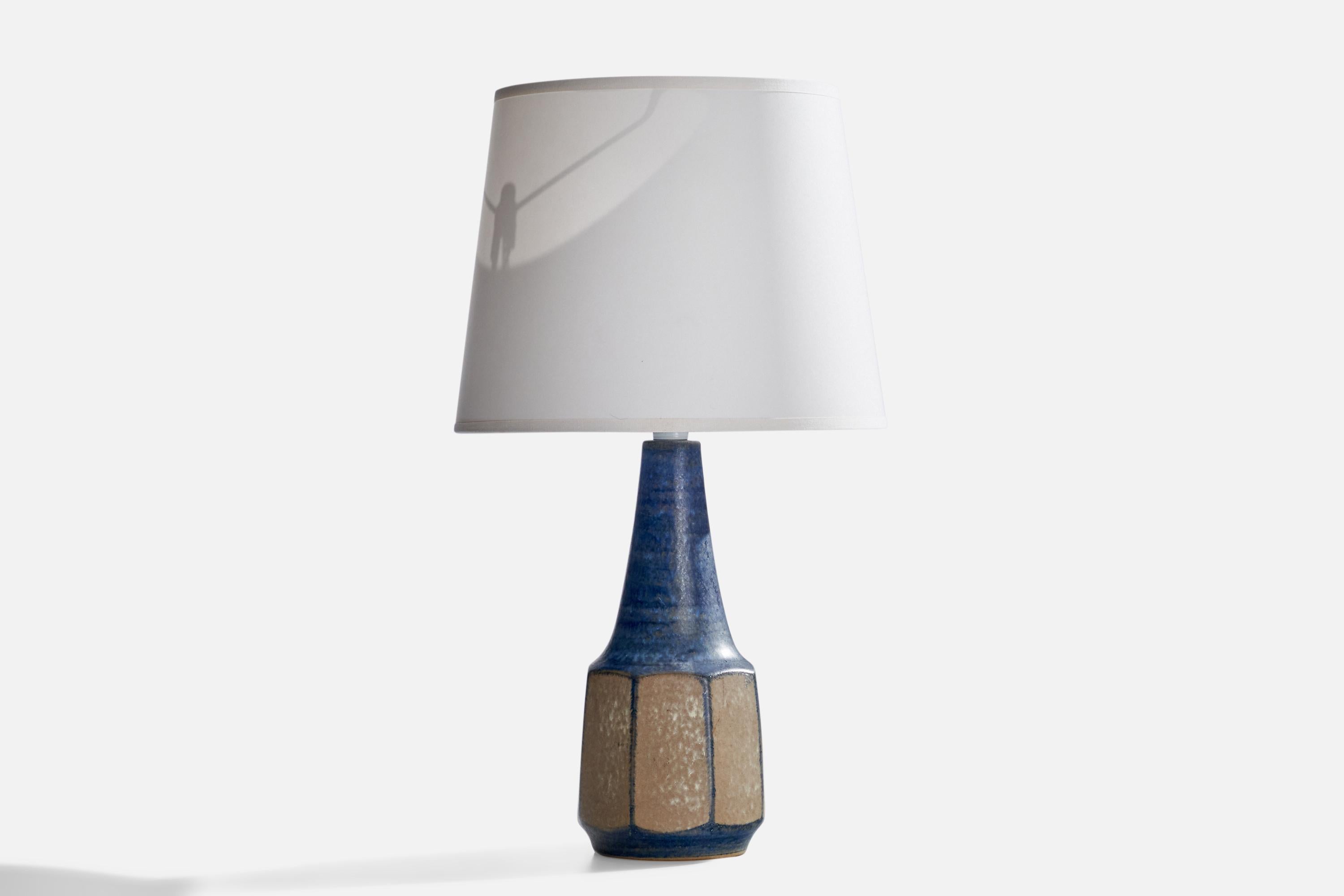 A blue-glazed stoneware table lamp designed by Marianne Starck and produced by Michael Andersen, Bornholm, Denmark, 1960s.

Dimensions of Lamp (inches): 12.25” H x 4.25” Diameter
Dimensions of Shade (inches): 8”  Top Diameter x 10”  Bottom Diameter