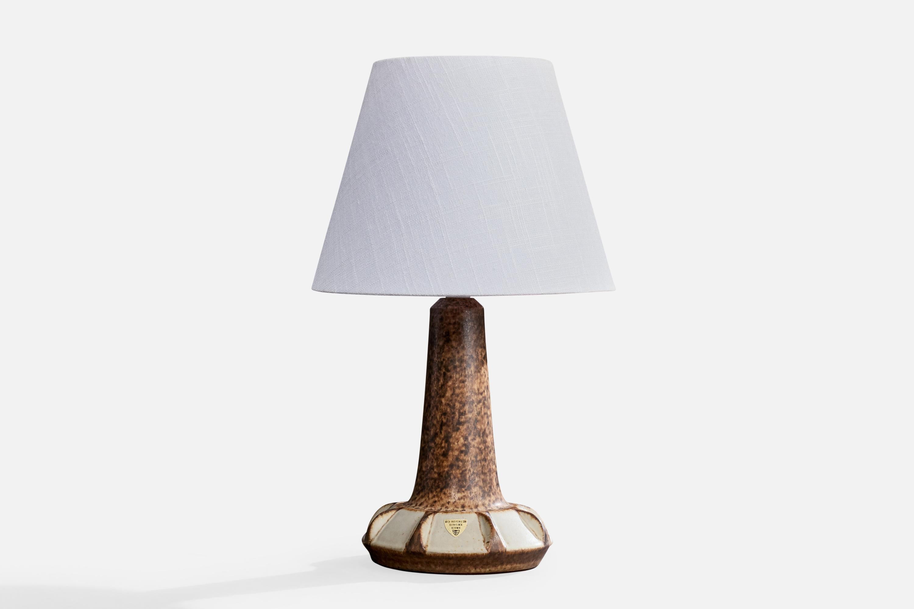 A brown and grey-glazed stoneware table lamp designed and produced in Denmark, c. 1960s.

Dimensions of Lamp (inches): 11.4
