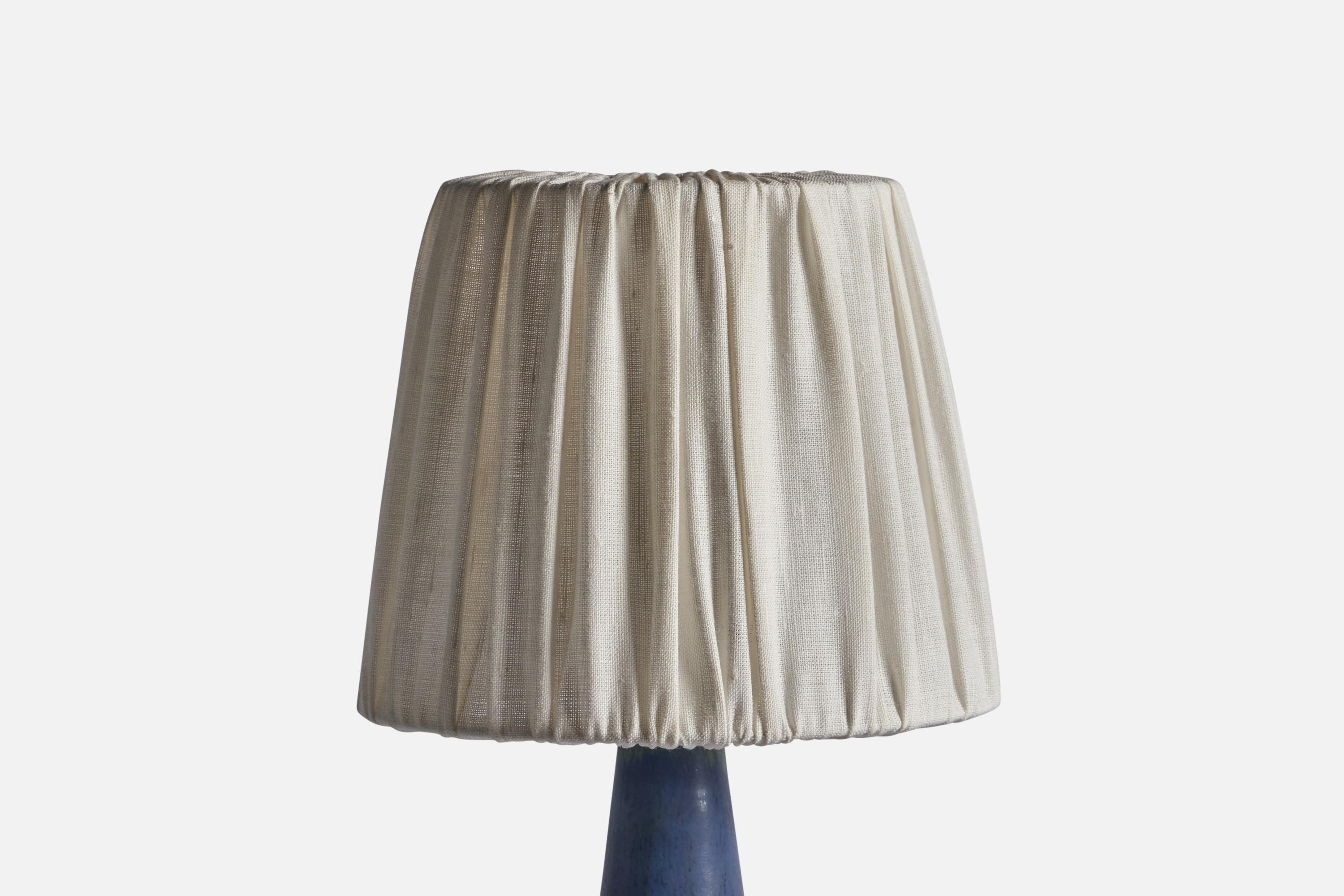 A stoneware and off-white fabric table lamp designed by Marianne Starck and produced by Michael Andersen, Bornholm, Denmark, 1960s.

Sold with lampshade

Stated dimensions include lampshade.

Size of base including height of socket, H 12.5, diameter