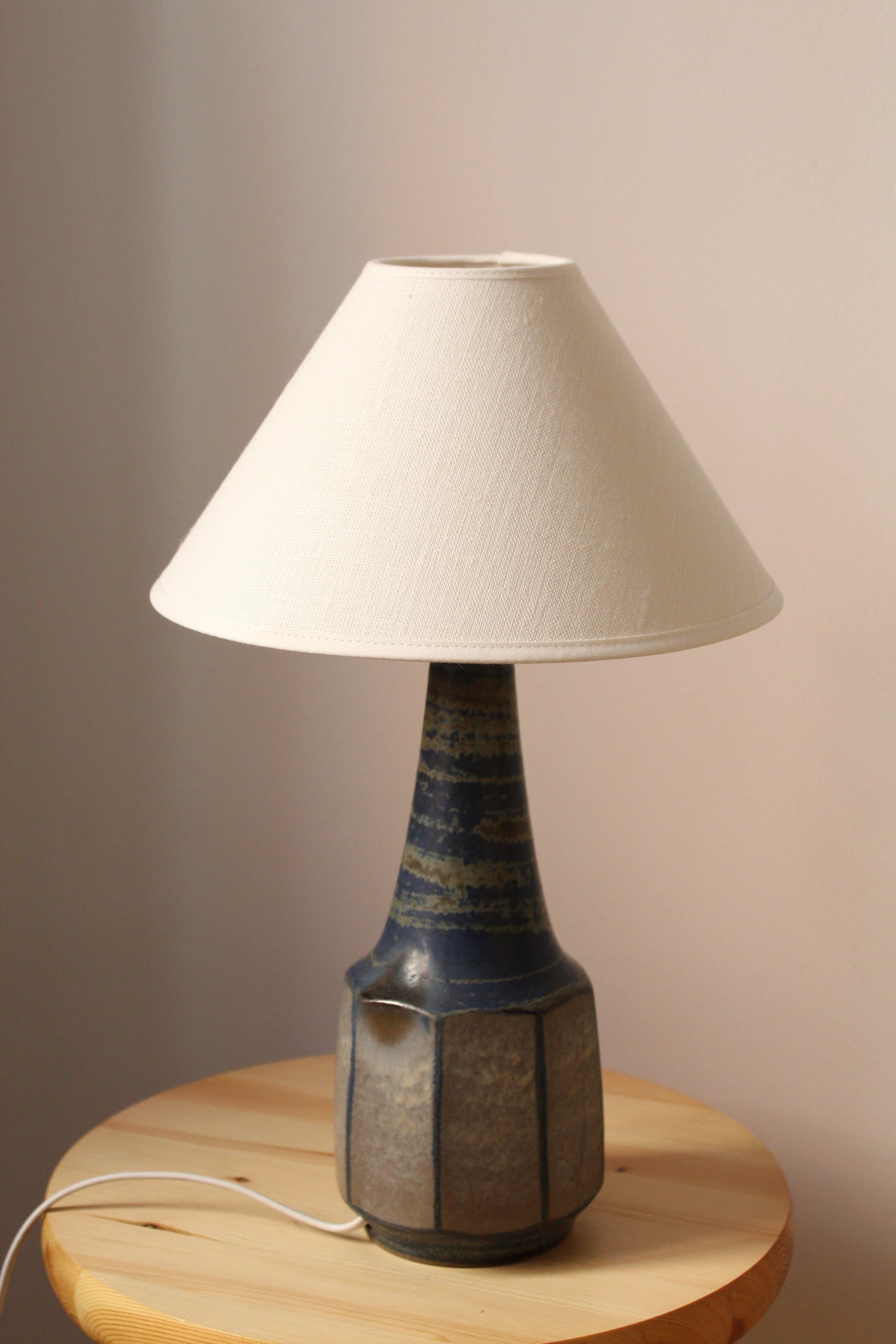 A table lamp designed by Marianne Starck produced by Michael Andersen Keramik. 

Purchase excludes lampshade. Stated measurements excluding lampshade.

Glaze features brown-green-blue colors.

Other ceramicists of the period include Axel Salto, Arne