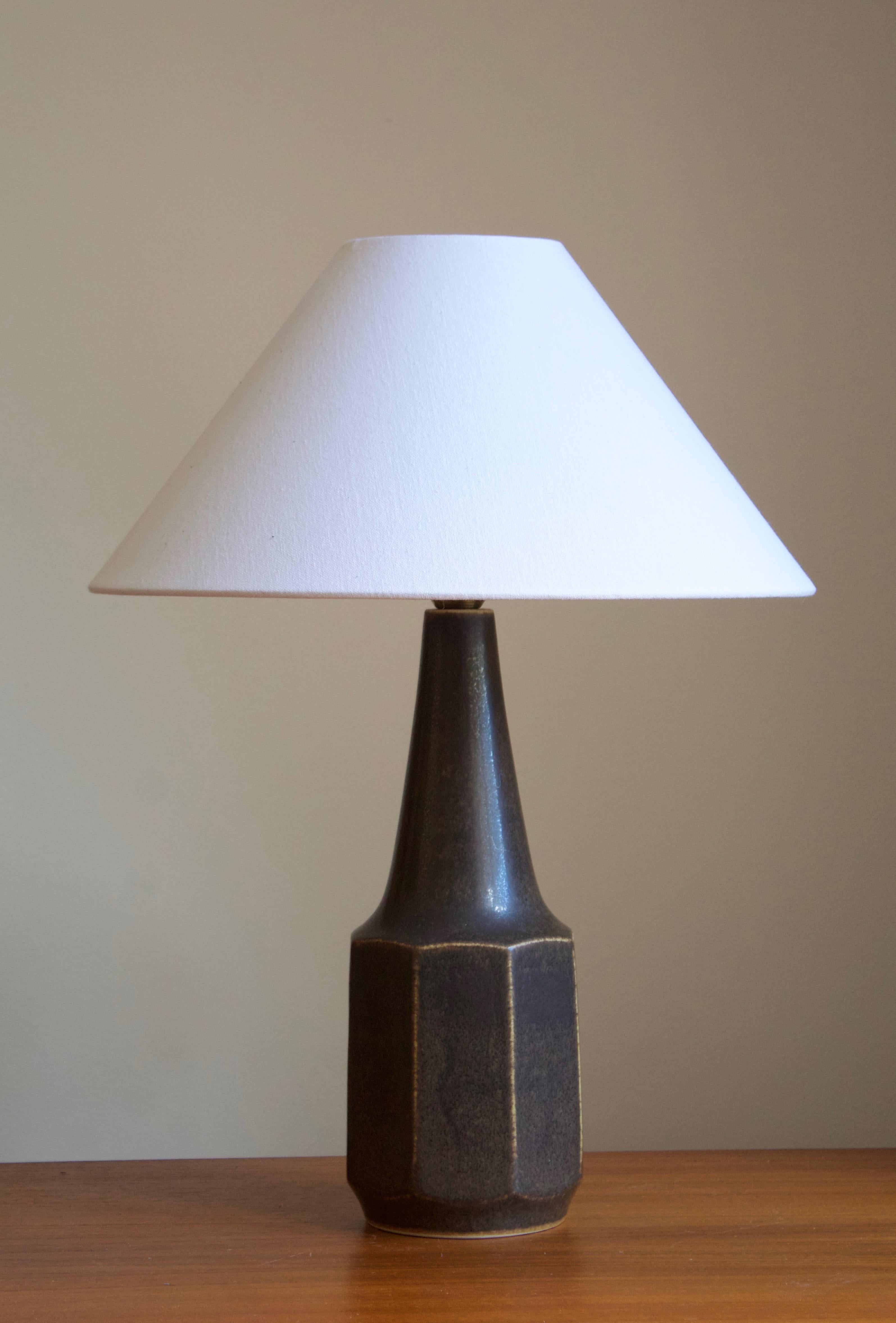 A table lamp designed by Marianne Starck produced by Michael Andersen Keramik.

Stated measurements excluding lampshade. Height includes socket. Sold without lampshade.

Glaze features a brown color.

Other ceramicists of the period include Axel