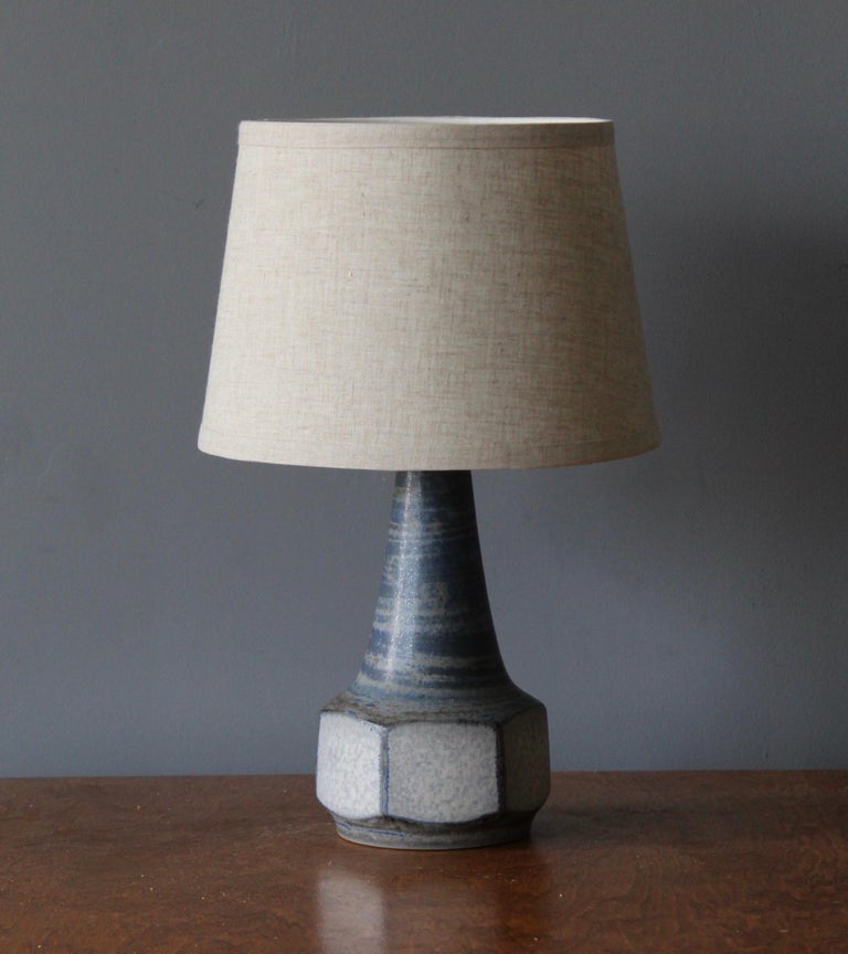 A table lamp designed by Marianne Starck produced by Michael Andersen Keramik. Handpainted.

Purchase excludes lampshade. Stated measurements excluding lampshade. Height includes socket.

Other ceramicists of the period include Axel Salto, Arne