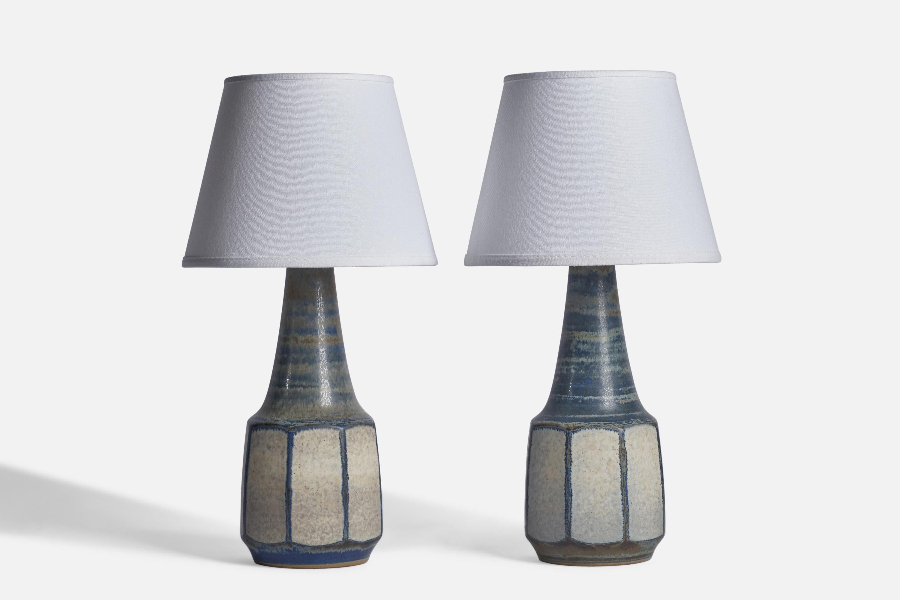 A pair of blue and grey-glazed stoneware table lamps designed by Marianne Starck and produced by Michael Andersen, Bornholm, Denmark, 1960s.
Dimensions of Lamp (inches): 12.5