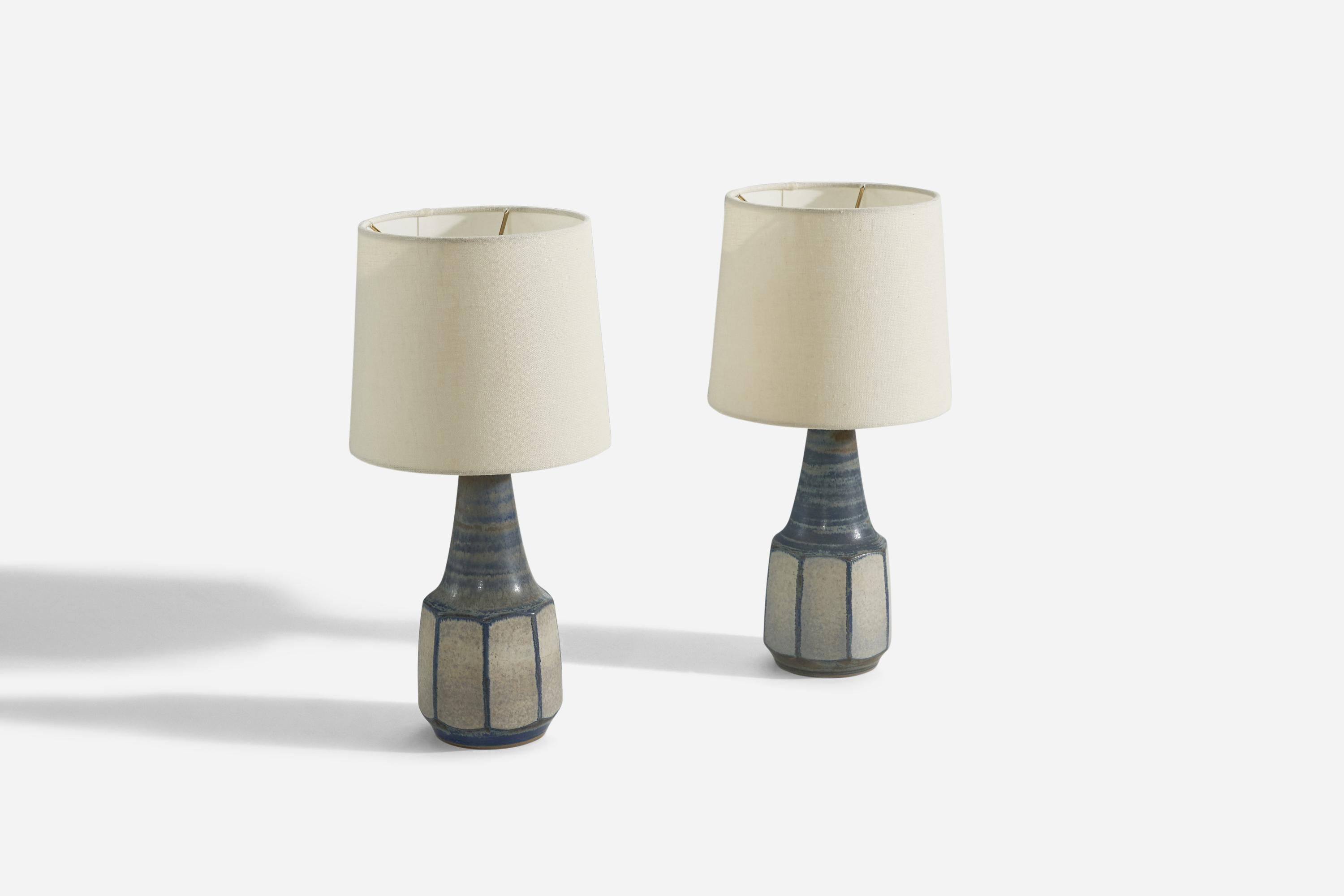 A pair of blue and grey, glazed stoneware table lamps designed by Marianne Starck and produced by Michael Andersen Keramik, Denmark, 1960s. 

Sold without lampshade. 
Dimensions of Lamp (inches) : (12.75 x 4.5 x 4.5) (H x W x D)
Dimensions of