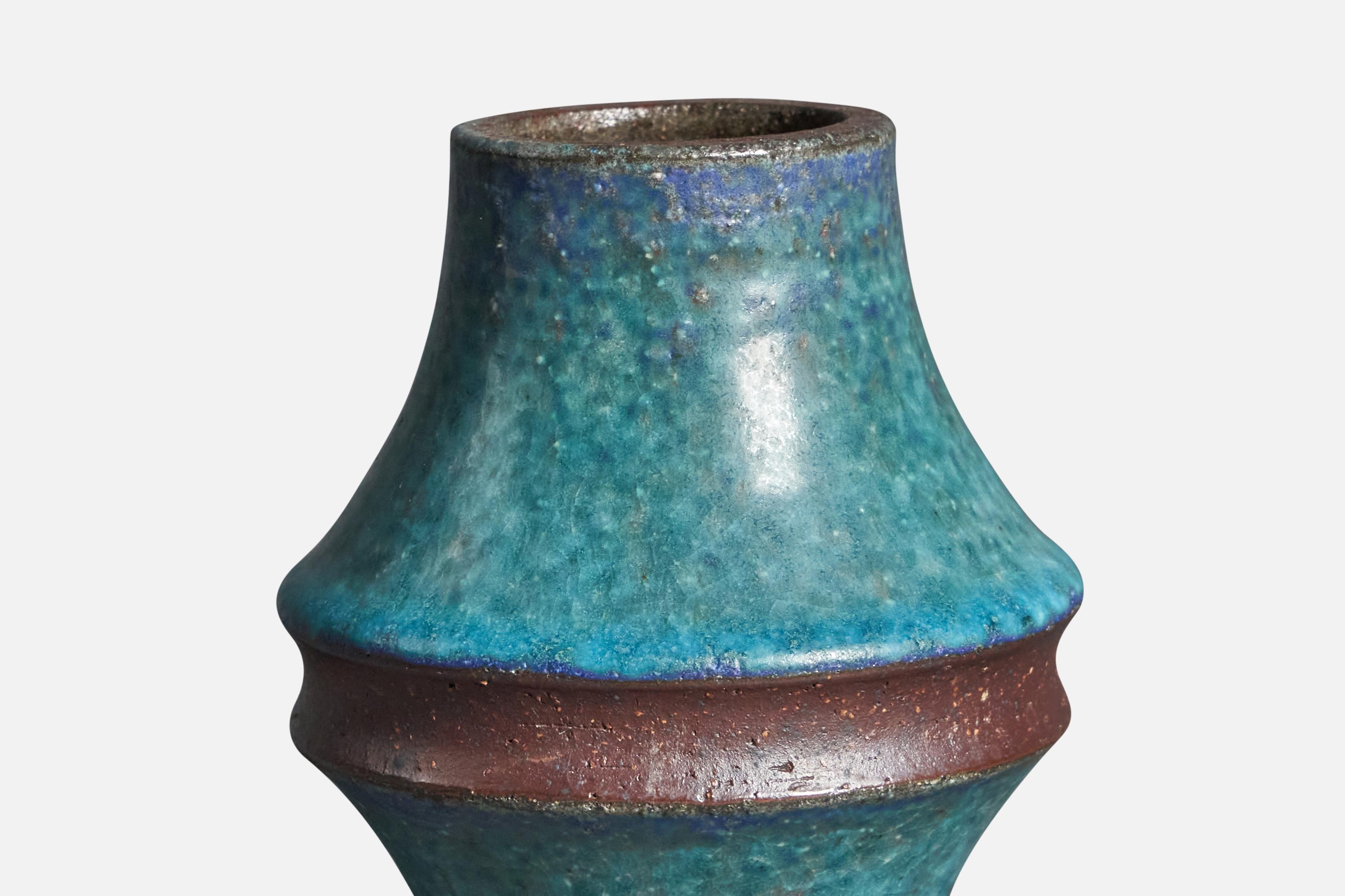 A blue-glazed stoneware vase, designed by Marianne Starck and produced by Michael Andersen, Bornholm, Denmark, c. 1960s.